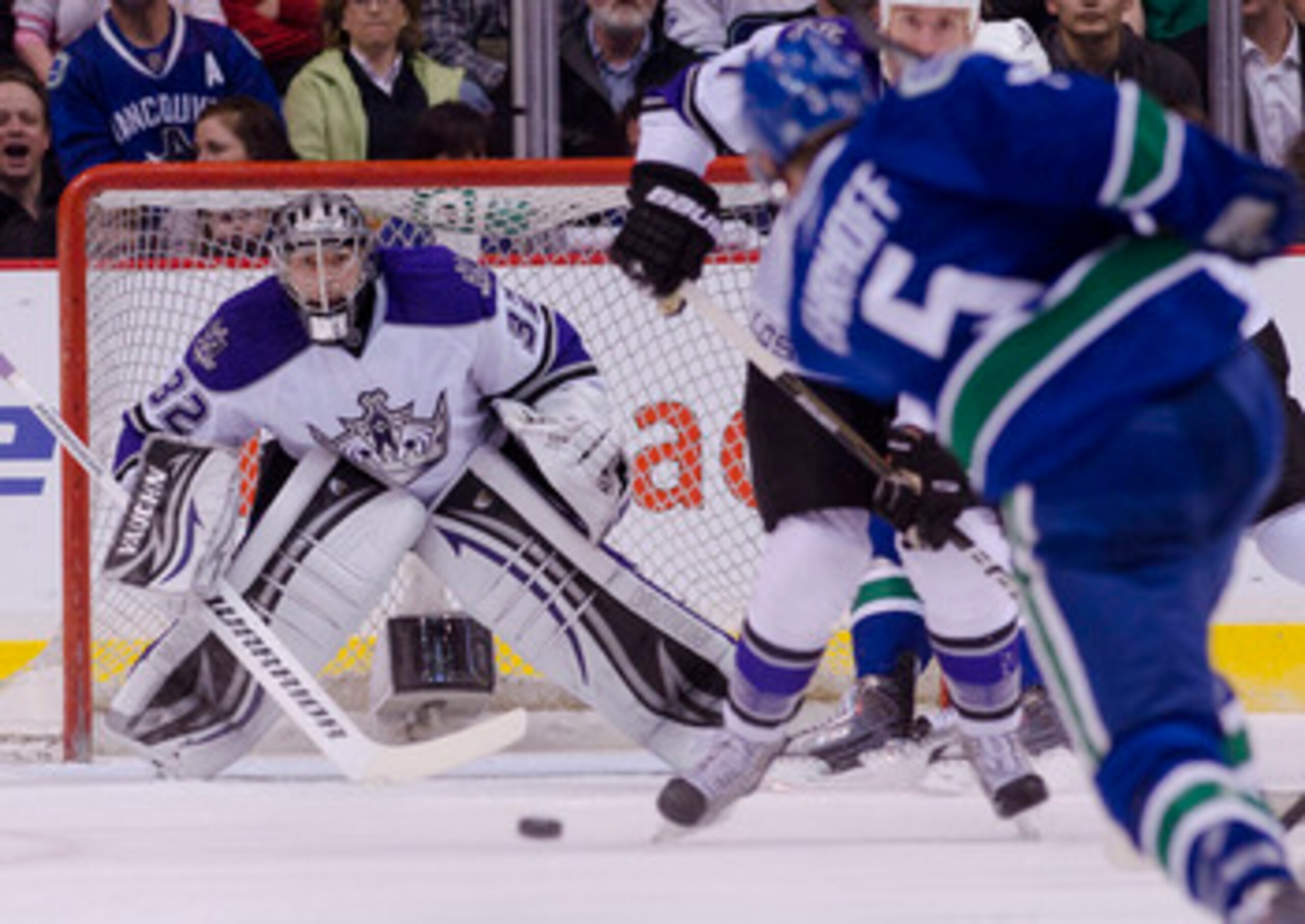 VANCOUVER, CANADA - MARCH 31: Goalie Jonathan Quick #32 of the Los Angeles Kings keeps an eye on the puck after being shot by Christian Ehrhoff #5 of the Vancouver Canucks during the first period in NHL action on March 31, 2011 at Rogers Arena in Vancouve