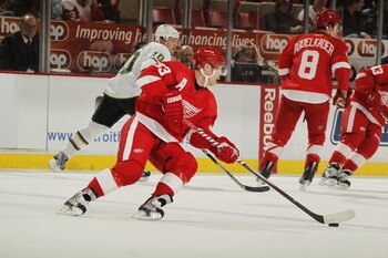 DETROIT, MI - FEBRUARY 24: Kris Draper #33 of the Detroit Red Wings skates with the puck against the Dallas Stars on February 24, 2011 at Joe Louis Arena in Detroit, Michigan. (Photo by Gregory Shamus/Getty Images) DETROIT, MI - FEBRUARY 24: Kris Draper #33 of the Detroit Red Wings skates with the puck against the Dallas Stars on February 24, 2011 at Joe Louis Arena in Detroit, Michigan. (Photo by Gregory Shamus/Getty Images)