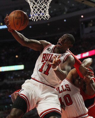 CHICAGO, IL - MAY 02: Ronnie Brewer #11 of the Chicago Bulls is fouled by Josh Smith #5 of the Atlanta Hawks in Game One of the Eastern Conference Semifinals in the 2011 NBA Playoffs at the United Center on May 2, 2011 in Chicago, Illinois. The Hawks defe