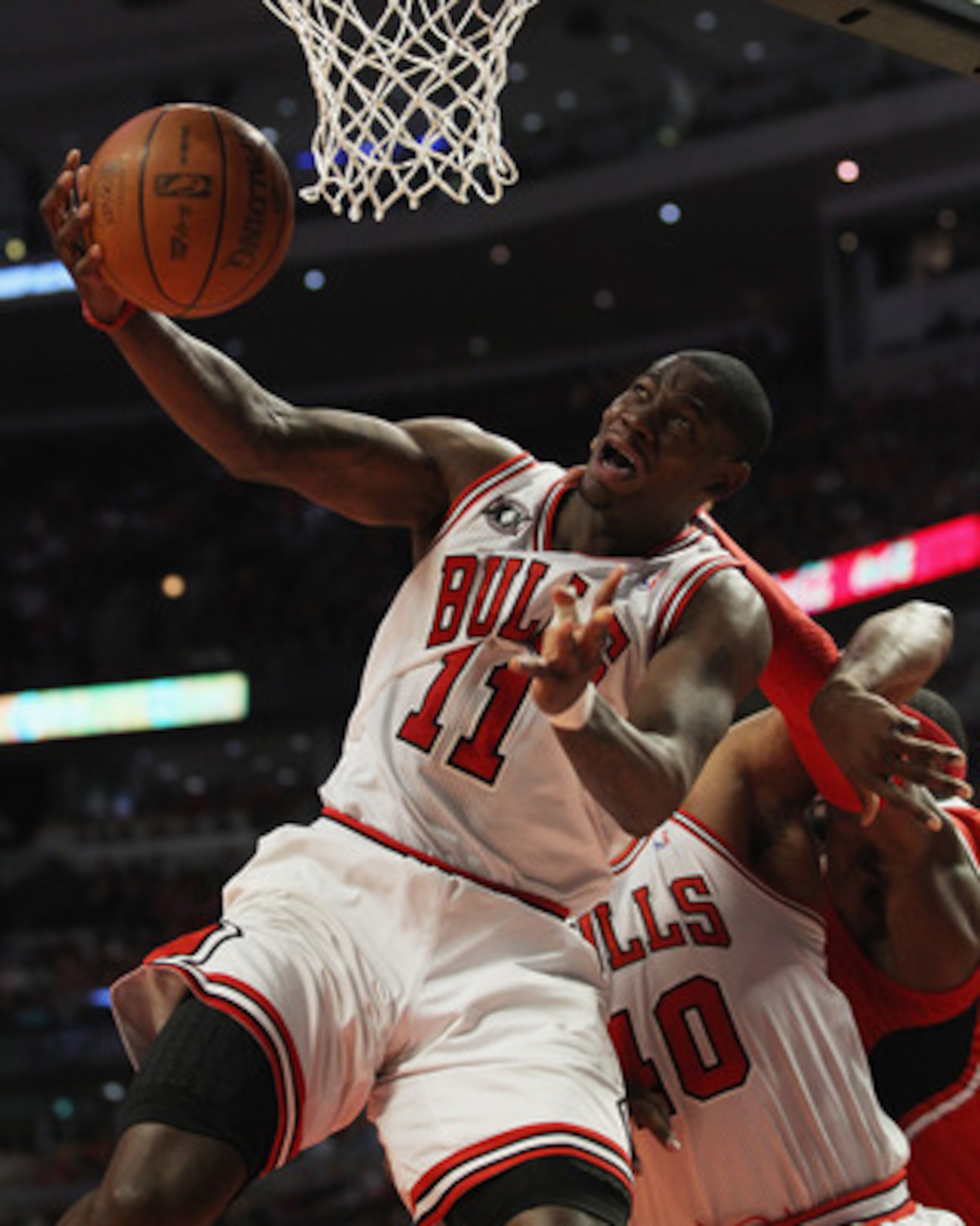 CHICAGO, IL - MAY 02: Ronnie Brewer #11 of the Chicago Bulls is fouled by Josh Smith #5 of the Atlanta Hawks in Game One of the Eastern Conference Semifinals in the 2011 NBA Playoffs at the United Center on May 2, 2011 in Chicago, Illinois. The Hawks defe