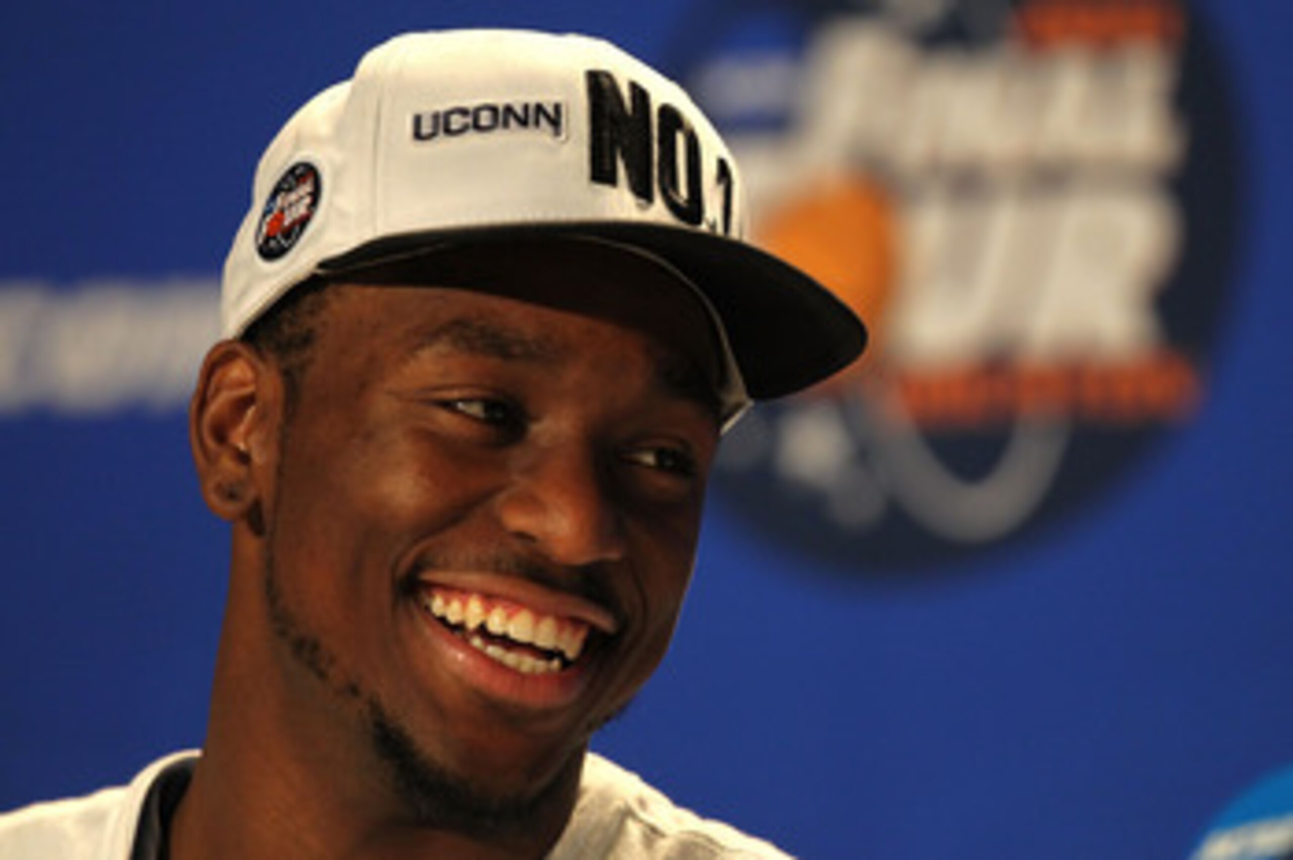 HOUSTON, TX - APRIL 04:  Kemba Walker #15 of the Connecticut Huskies speaks to the media after defeating the Butler Bulldogs to win the National Championship Game of the 2011 NCAA Division I Men's Basketball Tournament at Reliant Stadium on April 4, 2011 