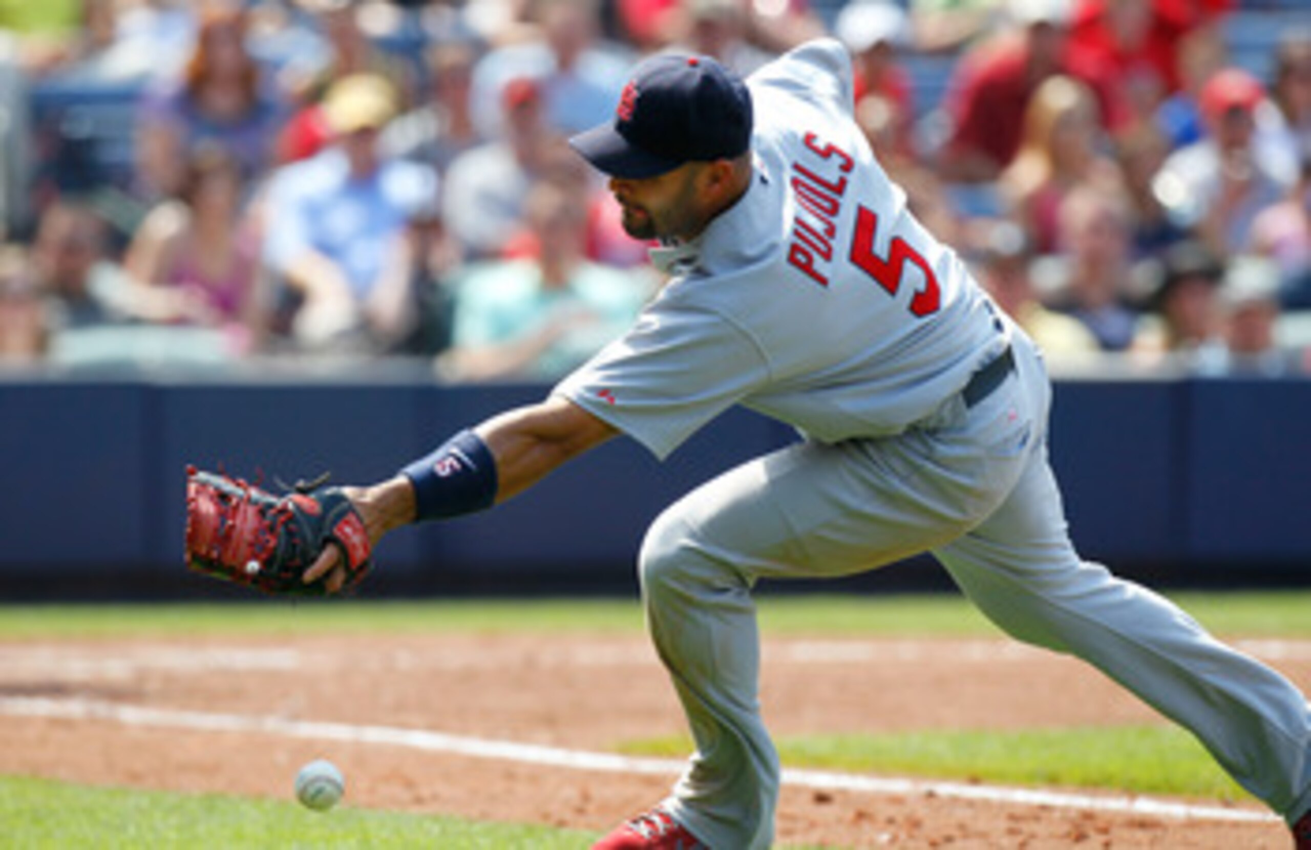 ATLANTA, GA - MAY 01: Albert Pujols #5 of the St. Louis Cardinals chases after a bunted foul ball hit by Alex Gonzalez #2 of the Atlanta Braves in the seventh inning at Turner Field on May 1, 2011 in Atlanta, Georgia. (Photo by Kevin C. Cox/Getty Images ATLANTA, GA - MAY 01: Albert Pujols #5 of the St. Louis Cardinals chases after a bunted foul ball hit by Alex Gonzalez #2 of the Atlanta Braves in the seventh inning at Turner Field on May 1, 2011 in Atlanta, Georgia. (Photo by Kevin C. Cox/Getty Images