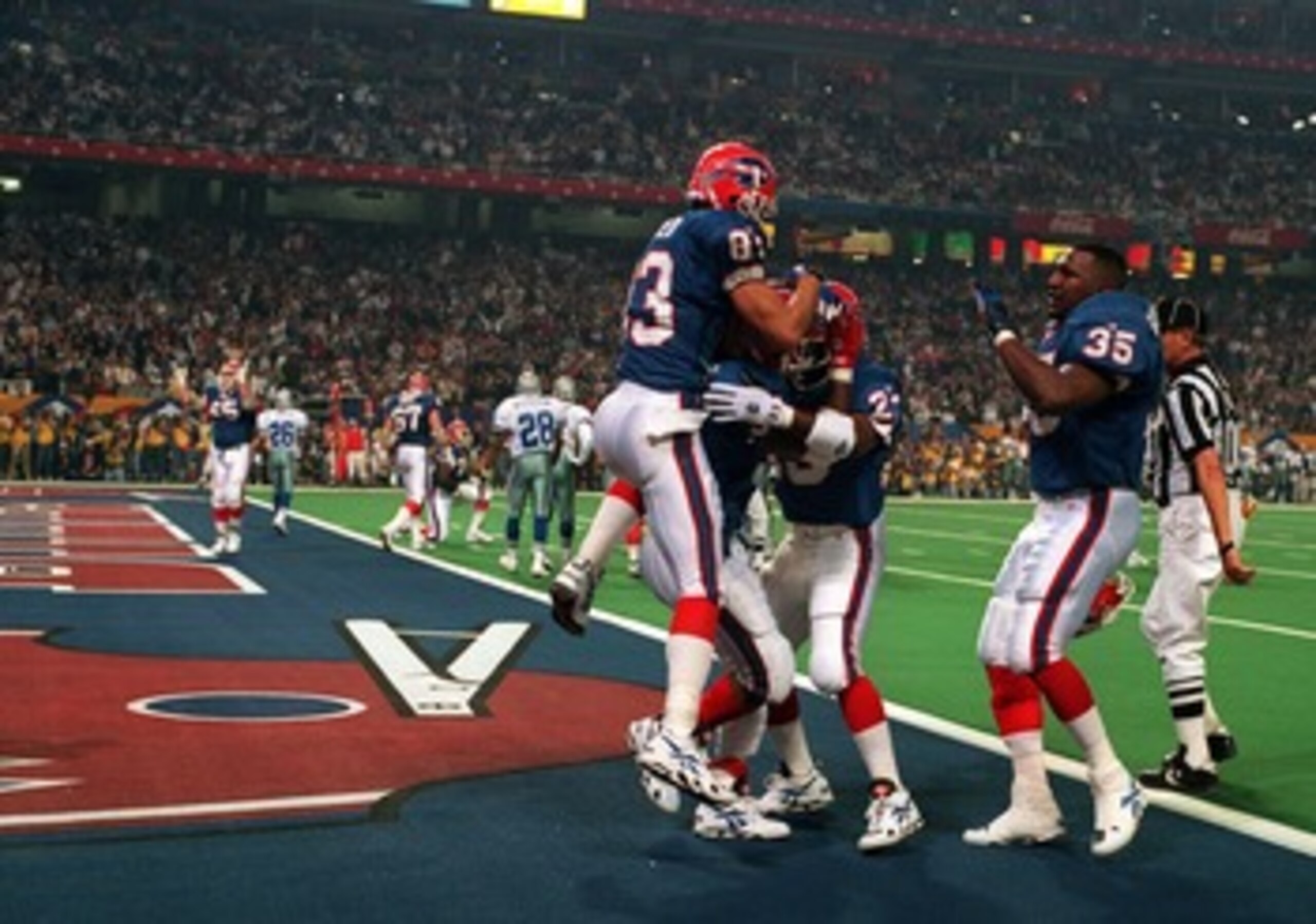 30 JAN 1994:  WIDE RECEIVER ANDRE REED #83, RUNNING BACK KENNETH DAVIS #23 AND FULLBACK CARWELL GARDNER #37 OF THE BUFFALO BILLS CELEBRATE A TOUCHDOWN DURING THE DALLAS COWBOYS 30-13 VICTORY OVER THE BUFFALO BILLS IN SUPER BOWL XXVIII AT THE GEORGIA DOME
