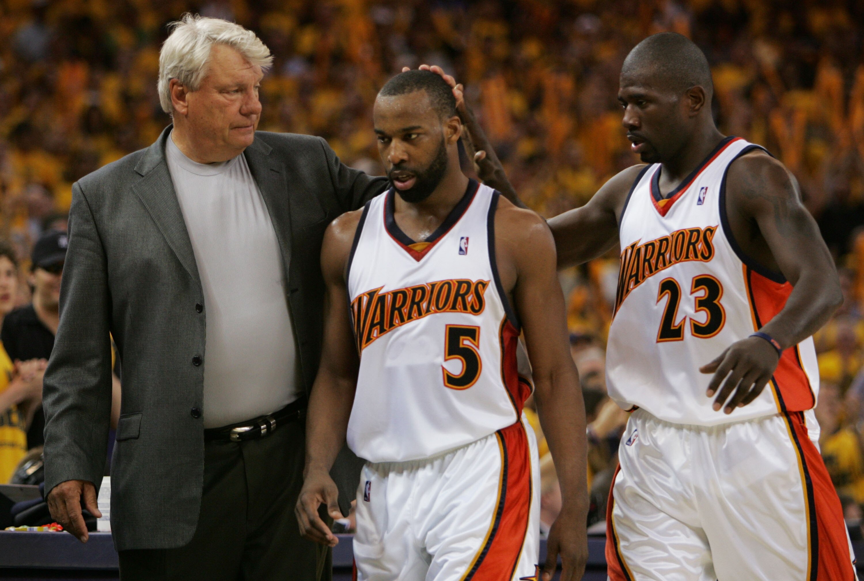 OAKLAND, CA - MAY 11:  Baron Davis #5 of the Golden State Warriors is congratulated by Head Coach Don Nelson and Jason Richardson #23 after defeating the Utah Jazz in Game Three of the Western Conference Semifinals during the 2007 NBA Playoffs at Oracle A