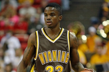 LAS VEGAS - MARCH 13:  Brandon Ewing #25 of the Wyoming Cowboys brings the ball up the court against the Utah Utes during a semifinal game of the Conoco Mountain West Conference Basketball Championships at the Thomas & Mack Center March 13, 2009 in Las Ve
