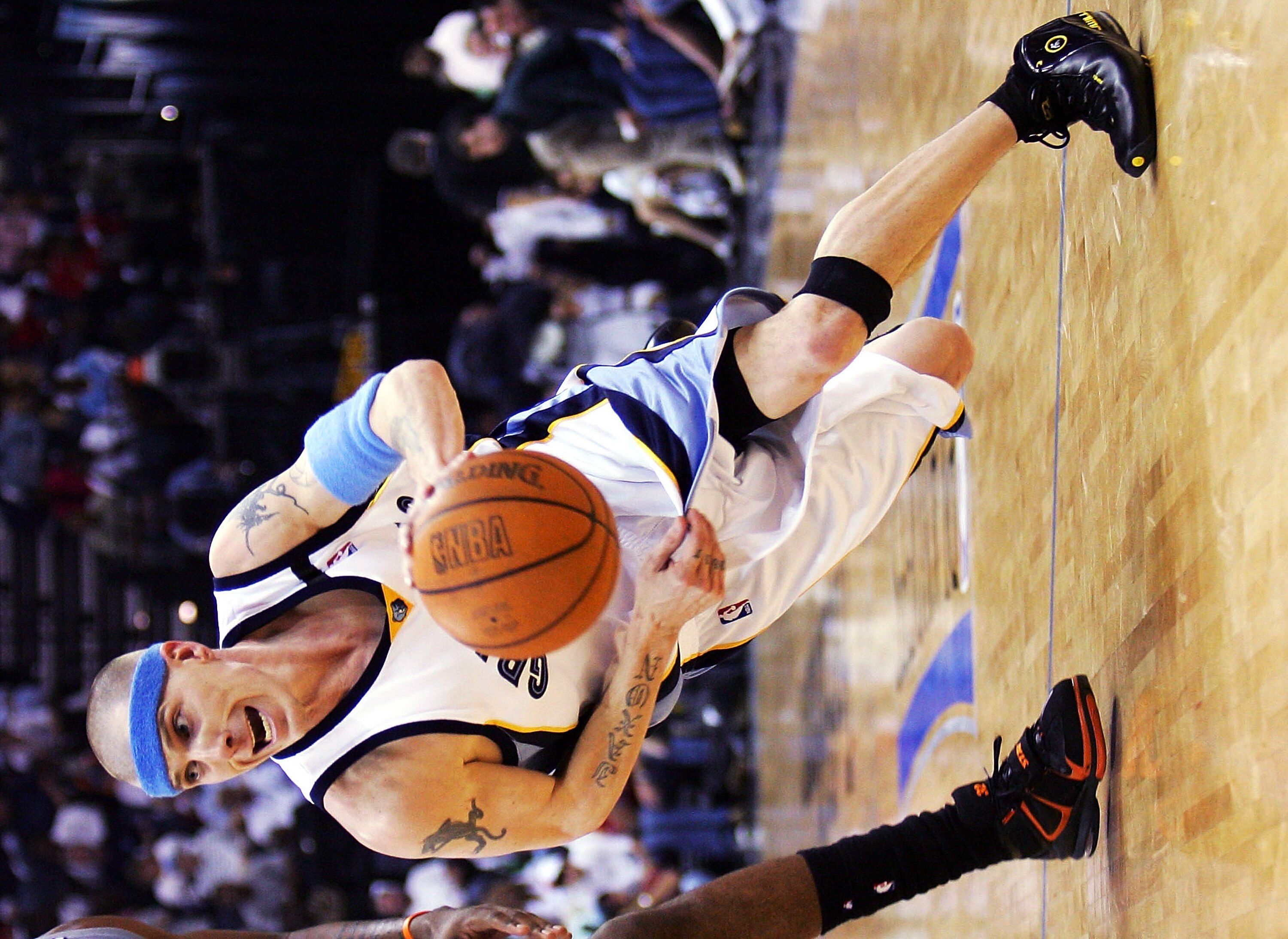 MEMPHIS, TN - MAY 1:  Jason Williams #2 of the Memphis Grizzlies drive around Amare Stoudemire #32 of the Phoenix Suns in Game four of the Western Conference Quarterfinals against the Phoenix Suns during the 2005 NBA Playoffs at the FedExForum on May 1, 2