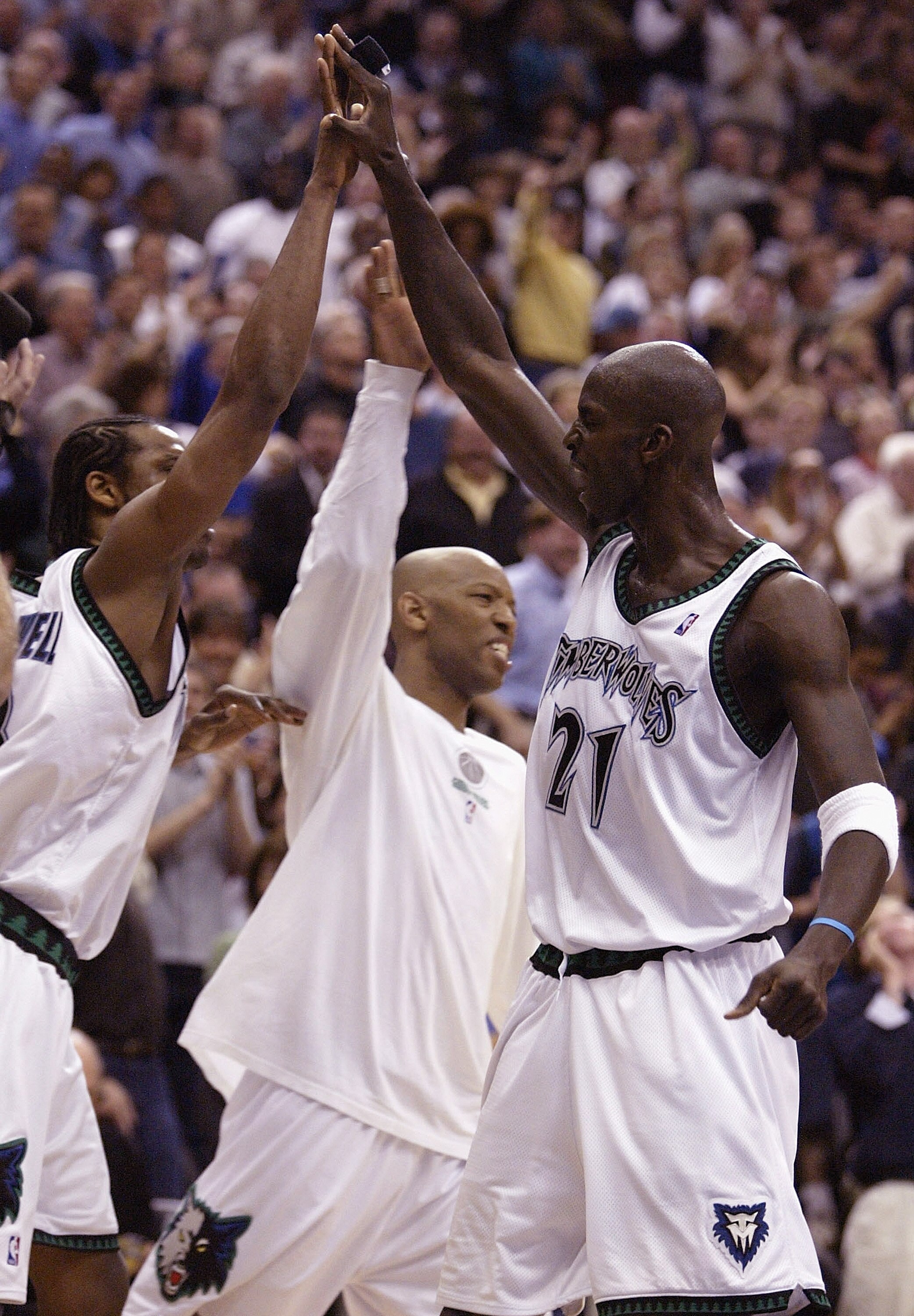 MINNEAPOLIS - APRIL 30:  Kevin Garnett #21 of the Minnesota Timberwolves celebrates with teammates Latrell Sprewell #8 and Sam Cassell #19 during a time out against the Denver Nuggets in Game 5 of the Western Conference Quarterfinals during the NBA playof