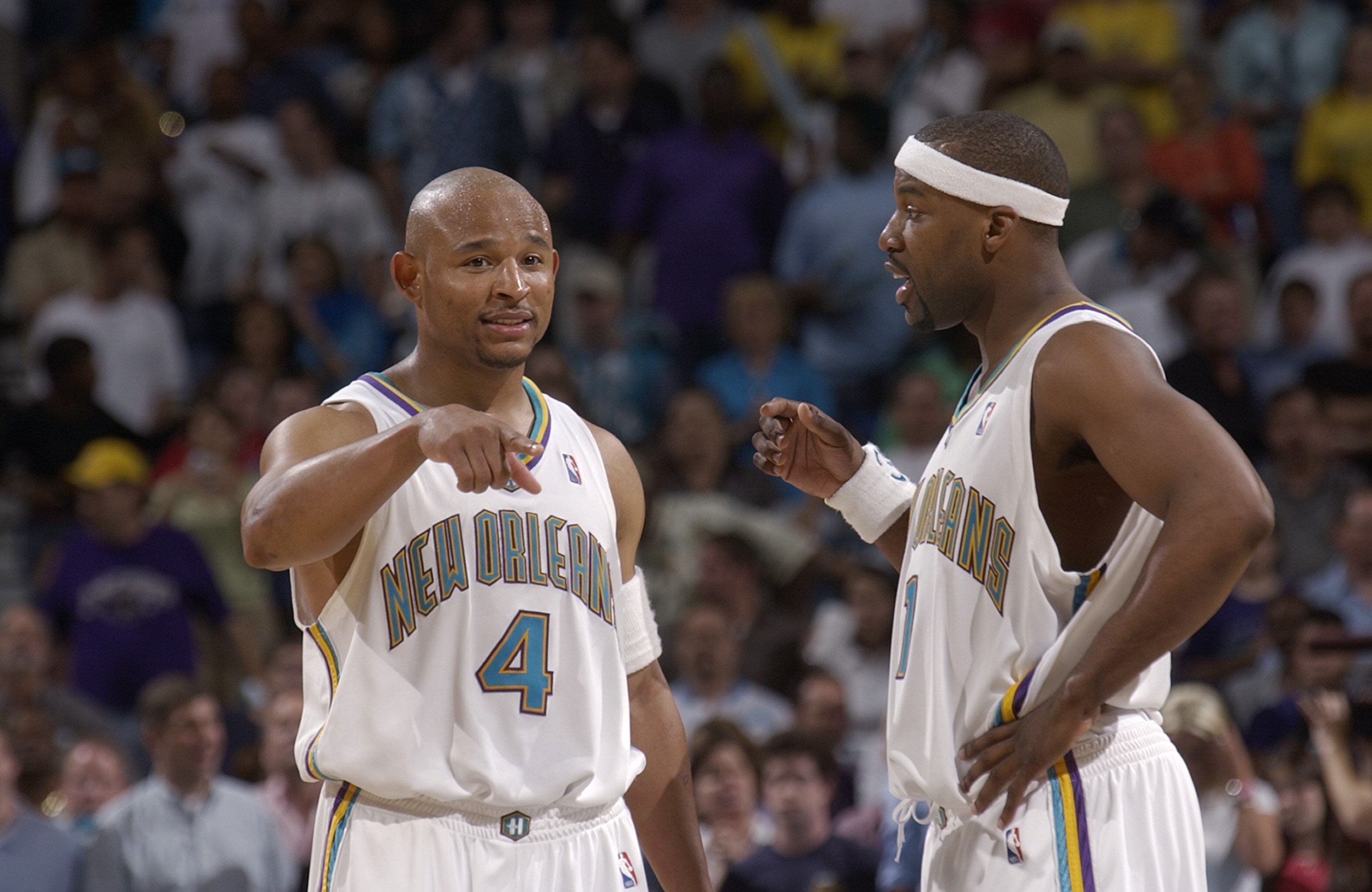 NEW ORLEANS - APRIL 24:  Baron Davis #1 and David Wesley #4 of the New Orleans Hornets talk on the court in Game three of the Eastern Conference Quarterfinals against the Miami Heat during the 2004 NBA Playoffs at New Orleans Arena on April 24, 2004 in Ne