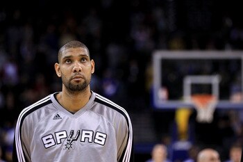 OAKLAND, CA - JANUARY 24:  Tim Duncan #21 of the San Antonio Spurs stands for the National Anthem before their game against the Golden State Warriors at Oracle Arena on January 24, 2011 in Oakland, California.  NOTE TO USER: User expressly acknowledges an