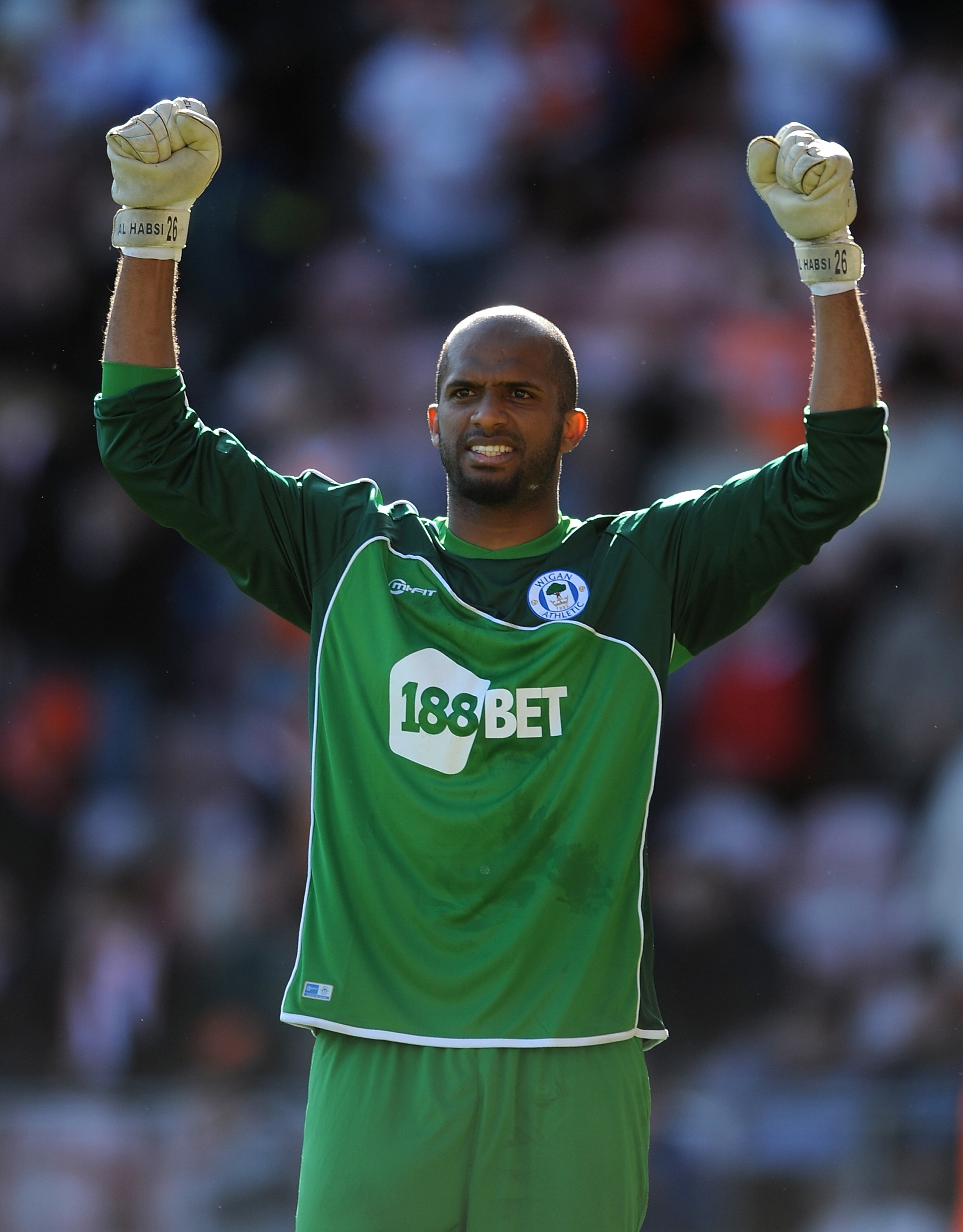BLACKPOOL, ENGLAND - APRIL 16: Ali Al Habsi of Wigan Athletic celebrates at full-time following the Barclays Premier League match between Blackpool and Wigan Athletic at Bloomfield Road on April 16, 2011 in Blackpool, England.  (Photo by Chris Brunskill/G