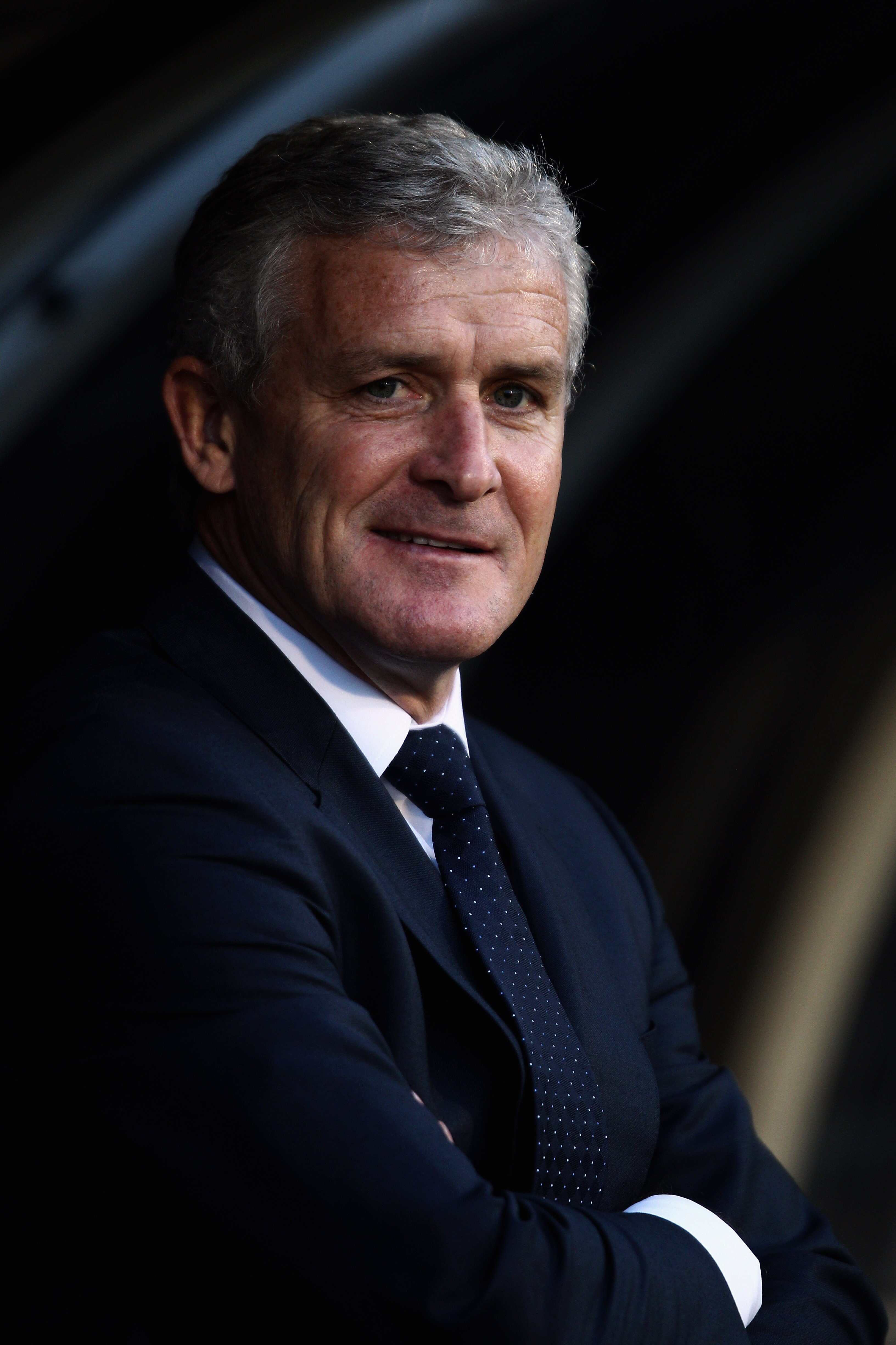 LONDON, ENGLAND - APRIL 27:  Fulham Manager, Mark Hughes smiles during the Barclays Premier League match between Fulham and Bolton Wanderers at Craven Cottage on April 27, 2011 in London, England.  (Photo by Dean Mouhtaropoulos/Getty Images)