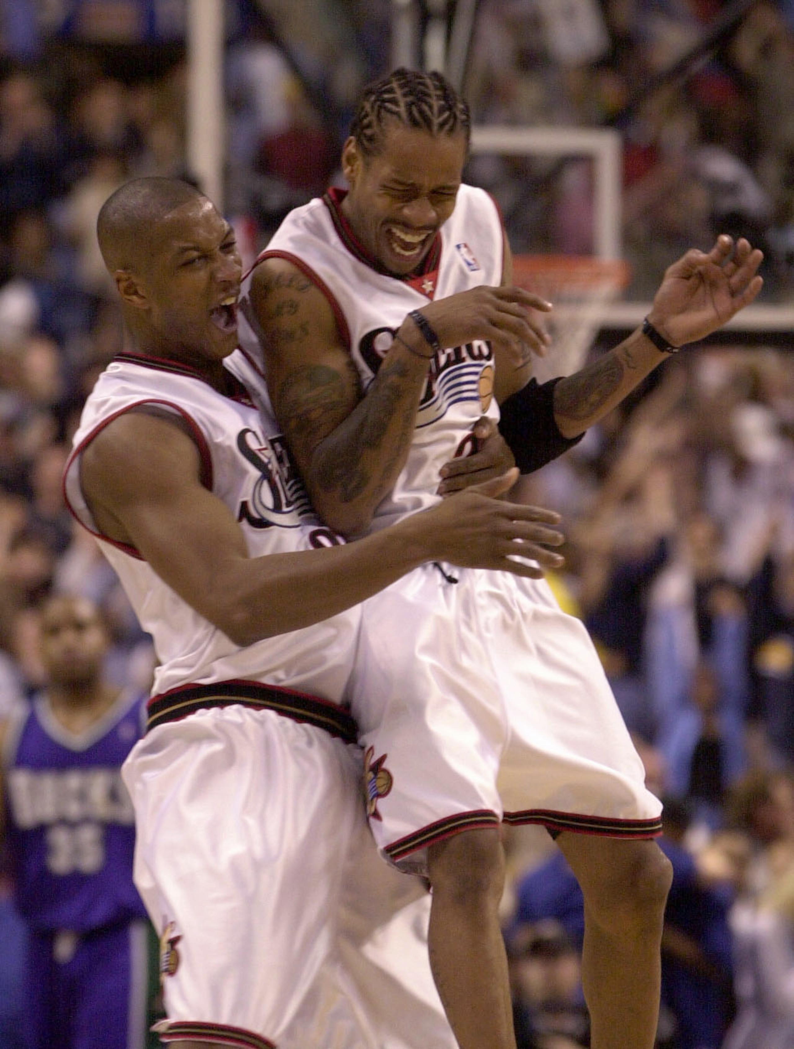 30 May 2001:  Allen Iverson #3 of the Philadelphia 76ers jumps into the arms of Eric Snow #20 after Snow made a shot to put the 76ers up 89-86 with 31 seconds remaining in game 5 of the Eastern Conference Finals at the First Union Center in Philadelphia,