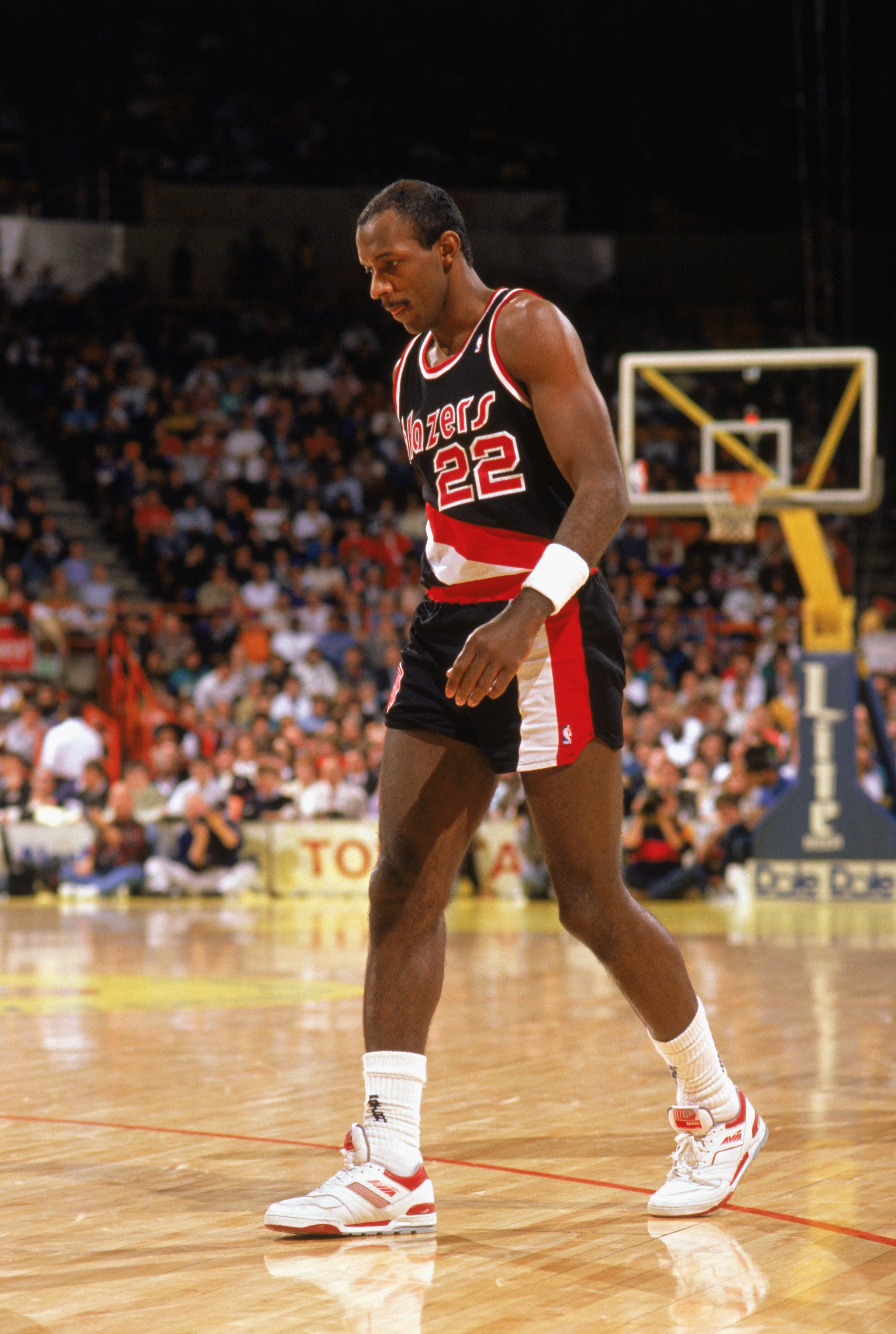 LOS ANGELES - 1990:  Clyde Drexler #22 of the Portland Trail Blazers walks during the 1989-1990 NBA season game against the Los Angeles Lakers at the Great Western Forum in Los Angeles, California.  (Photo by Ken Levine/Getty Images)