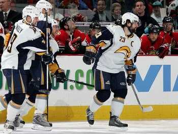 OTTAWA, ON - MAY 16:  Chris Drury #23 of the Buffalo Sabres smiles as he celebrates with teammates after assisting teammate Derek Roy #9 to score in the first nine seconds of the first period of Game 4 of the 2007 Eastern Conference Finals on May 16, 2007