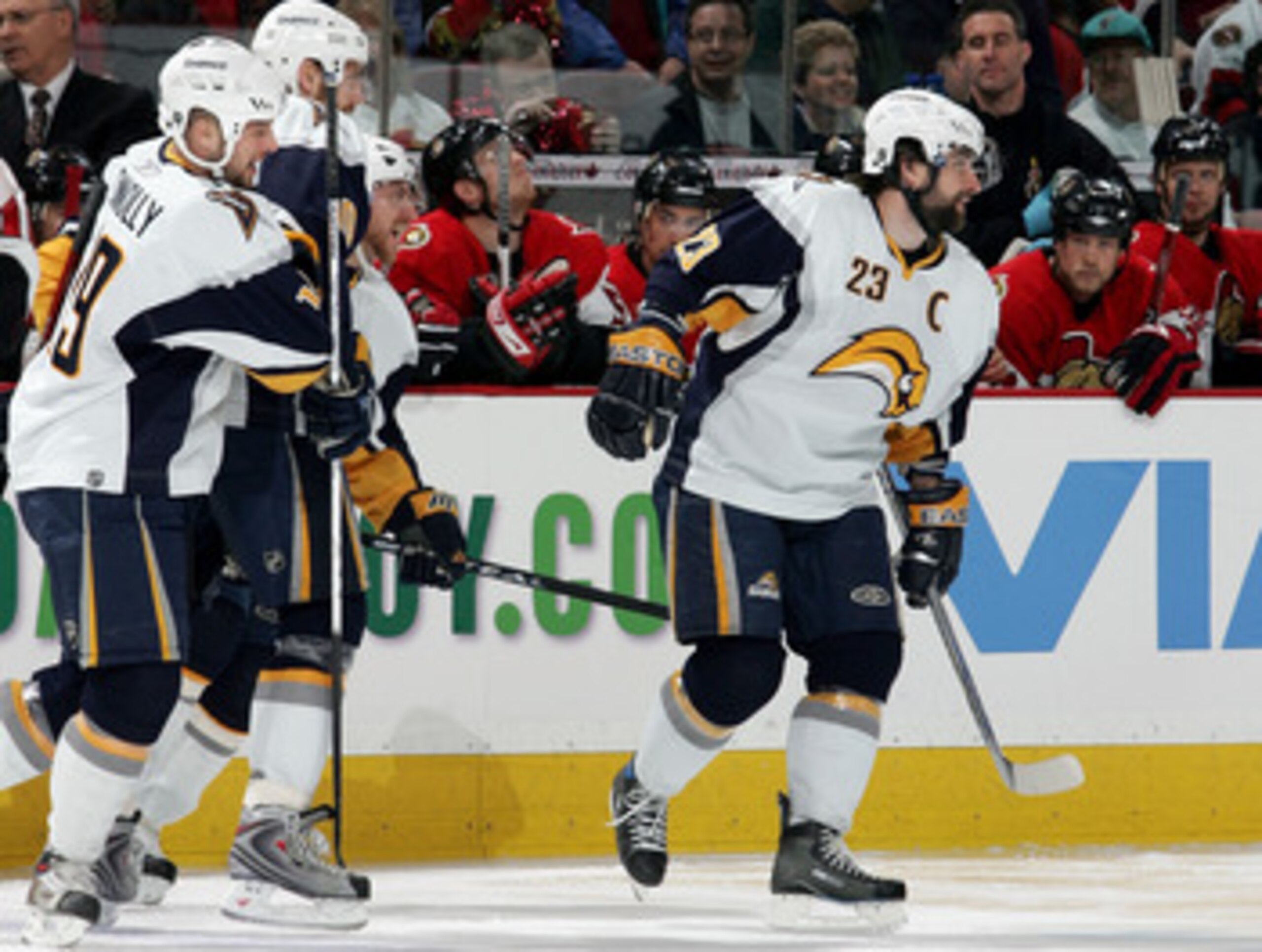OTTAWA, ON - MAY 16:  Chris Drury #23 of the Buffalo Sabres smiles as he celebrates with teammates after assisting teammate Derek Roy #9 to score in the first nine seconds of the first period of Game 4 of the 2007 Eastern Conference Finals on May 16, 2007