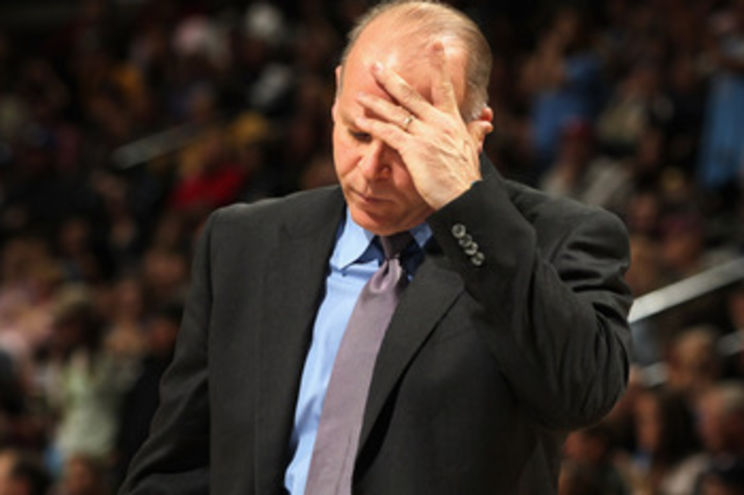 DENVER, CO - MARCH 12: Head coach John Kuester of the Detroit Pistons reacts during a time out against the Denver Nuggets at the Pepsi Center on March 12, 2011 in Denver, Colorado. The Nuggets defeated the Pistons 131-101. NOTE TO USER: User expressly a DENVER, CO - MARCH 12: Head coach John Kuester of the Detroit Pistons reacts during a time out against the Denver Nuggets at the Pepsi Center on March 12, 2011 in Denver, Colorado. The Nuggets defeated the Pistons 131-101. NOTE TO USER: User expressly a