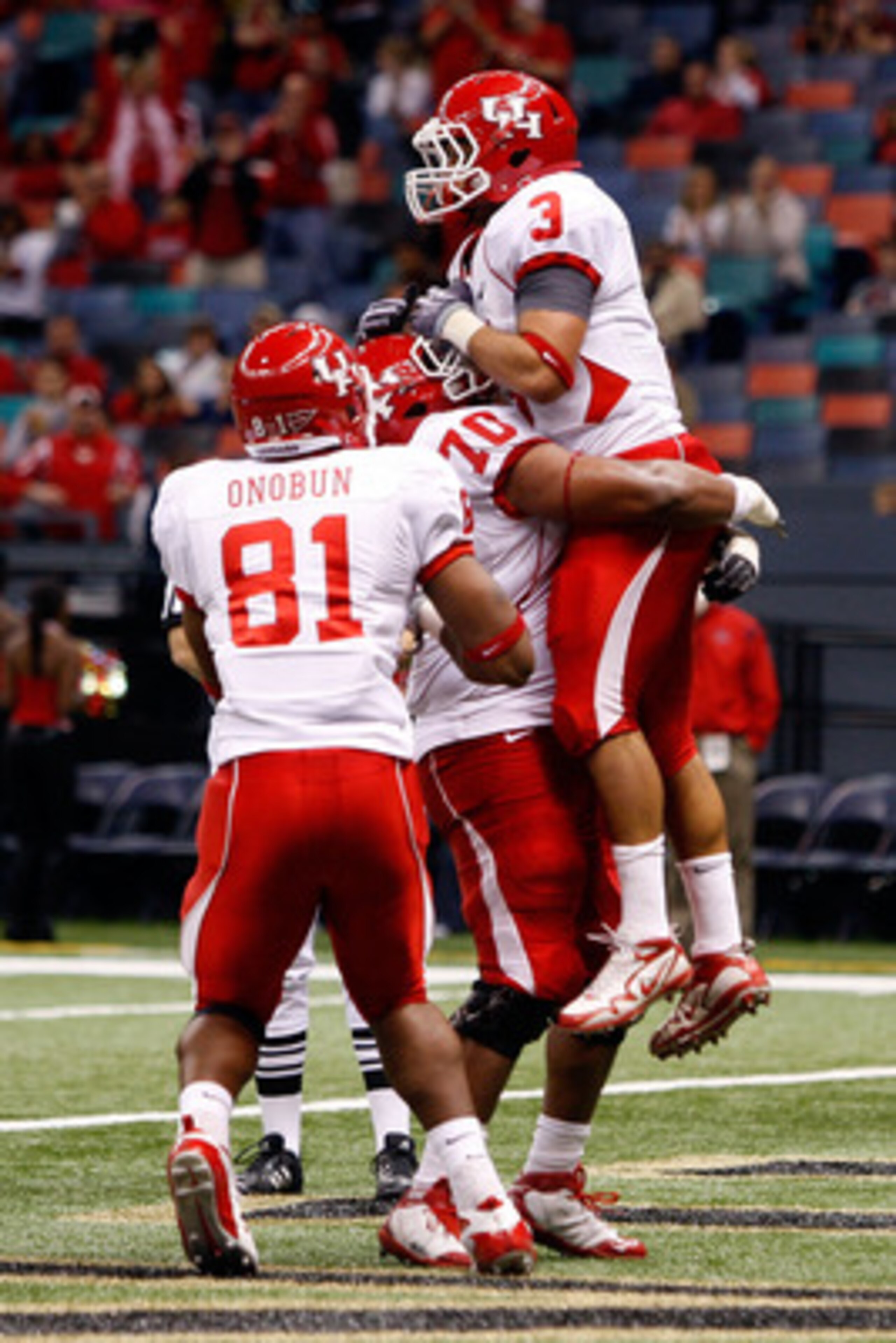 NEW ORLEANS - OCTOBER 17:  Justin Johnson #3 of the Houston Cougars celebrates after a touchdown against the Tulane Green Wave at the Louisiana Superdome on October 17, 2009 in New Orleans, Louisiana.  The Cougars defeated the Green Wave 44-16.  (Photo by