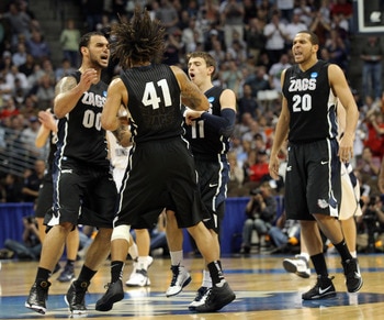 DENVER, CO - MARCH 19:  David Stockton #11, Elias Harris #20, Steven Gray #41 and Robert Sacre #00 of the Gonzaga Bulldogs celebrate after a playing against the Brigham Young Cougars during the third round of the 2011 NCAA men's basketball tournament at P