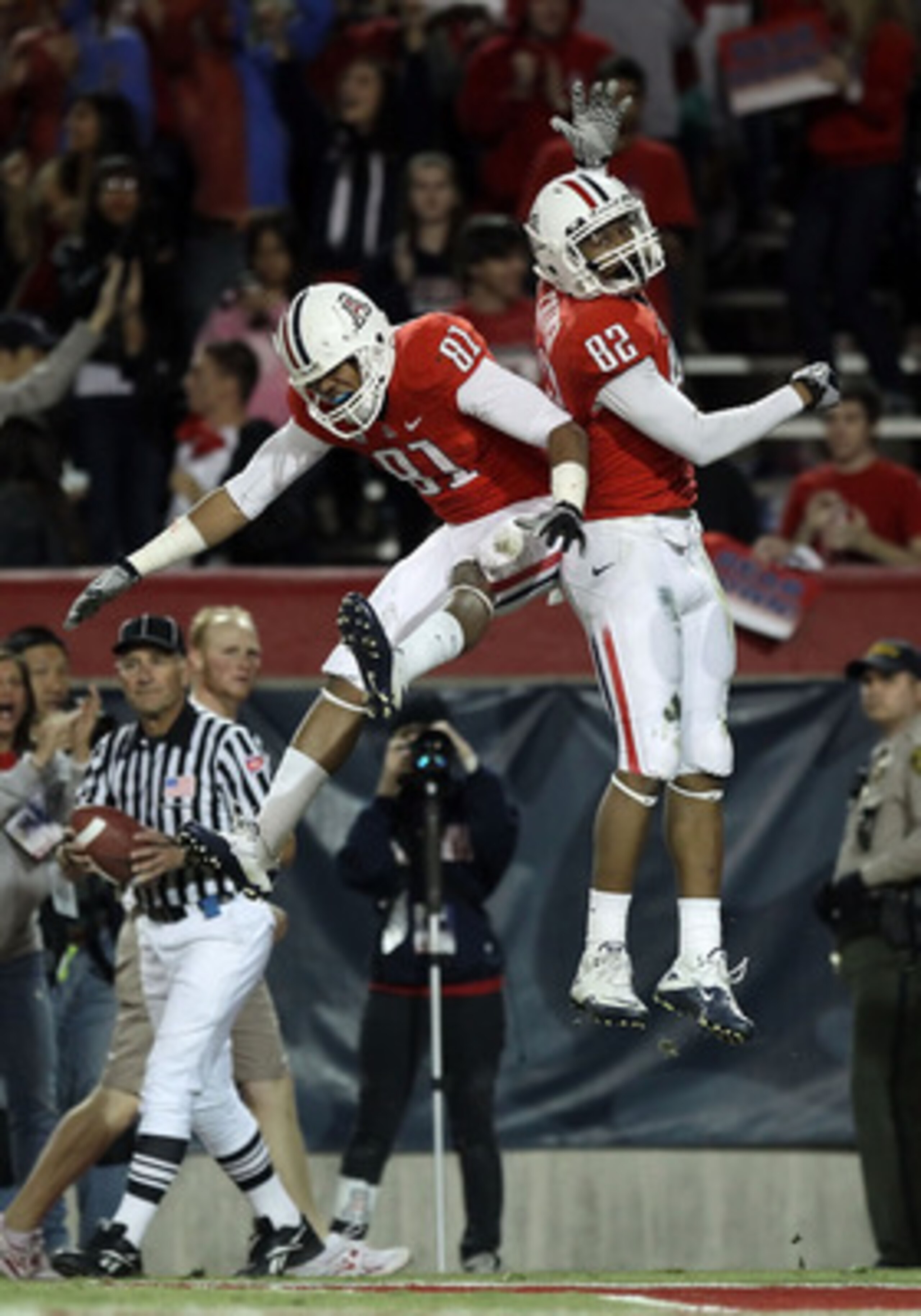 TUCSON, AZ - DECEMBER 02:  Wide receiver Juron Criner #82 of the Arizona Wildcats and David Roberts #81 celebrate after Criner scored a 28 yard touchdown reception against the Arizona State Sun Devils during the college football game at Arizona Stadium on