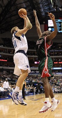 DALLAS - JANUARY 26:  Forward Dirk Nowitzki #41 of the Dallas Mavericks takes a shot against Luc Mbah a Moute #12 of the Milwaukee Bucks on January 26, 2010 at American Airlines Center in Dallas, Texas.  NOTE TO USER: User expressly acknowledges and agree