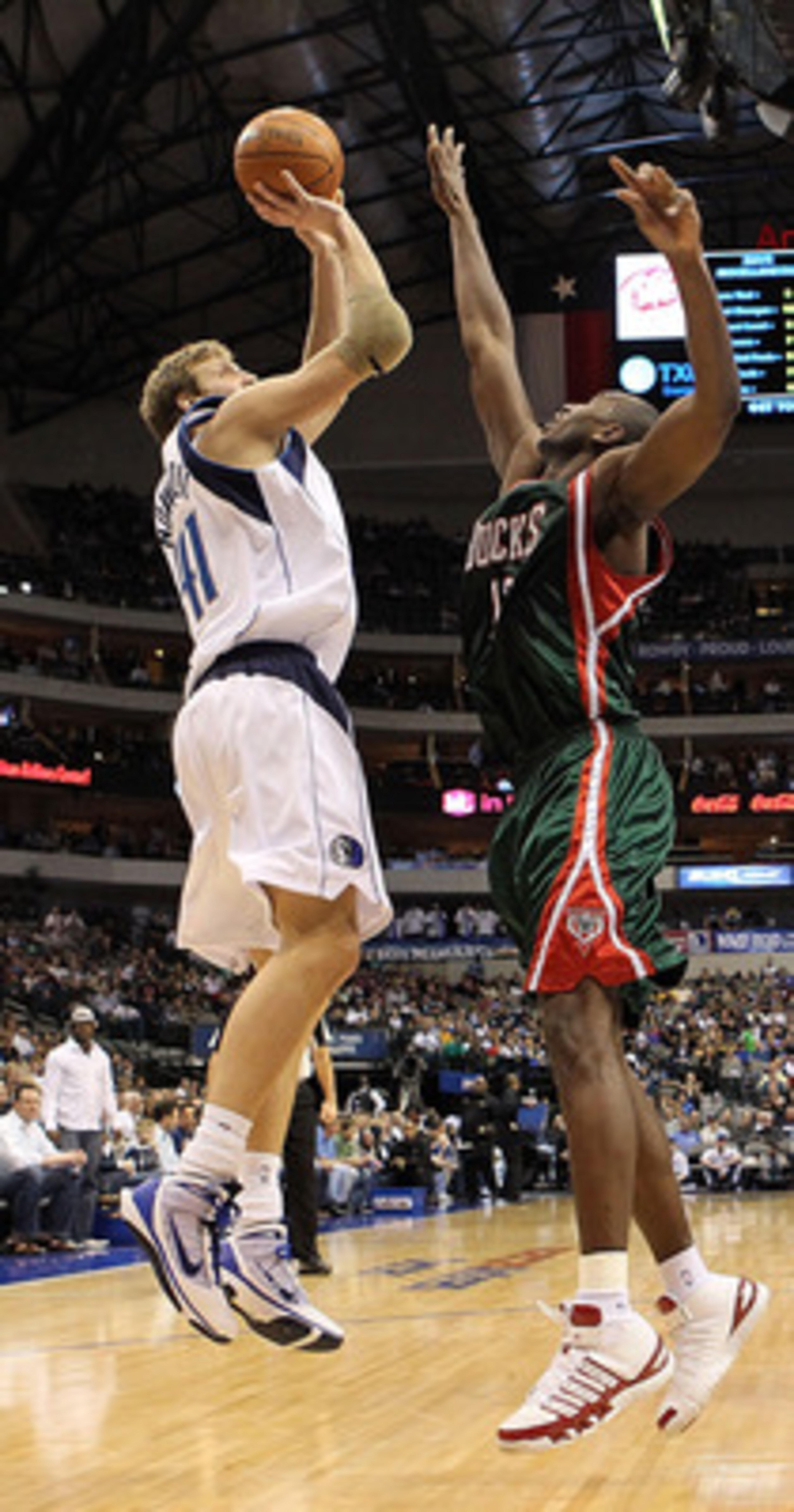 DALLAS - JANUARY 26:  Forward Dirk Nowitzki #41 of the Dallas Mavericks takes a shot against Luc Mbah a Moute #12 of the Milwaukee Bucks on January 26, 2010 at American Airlines Center in Dallas, Texas.  NOTE TO USER: User expressly acknowledges and agree