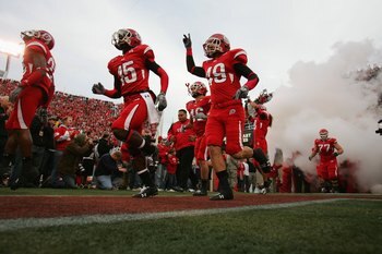SALT LAKE CITY, UT - NOVEMBER 22:  DeVonte Christopher #15 and Greg Bird #49 of the Utah Utes run onto the field before the game against the BYU Cougars at Rice-Eccles Stadium on November 22, 2008 in Salt Lake City, Utah. (Photo by Jonathan Ferrey/Getty I