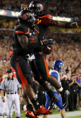 LANDOVER, MD - SEPTEMBER 06:  Running back Ryan Williams #34 of the Virginia Tech Hokies celebrates with quaretrback #7 Tyrod Taylor after a touchdown in the second quarter against the Boise State Broncos at FedExField on September 6, 2010 in Landover, Ma