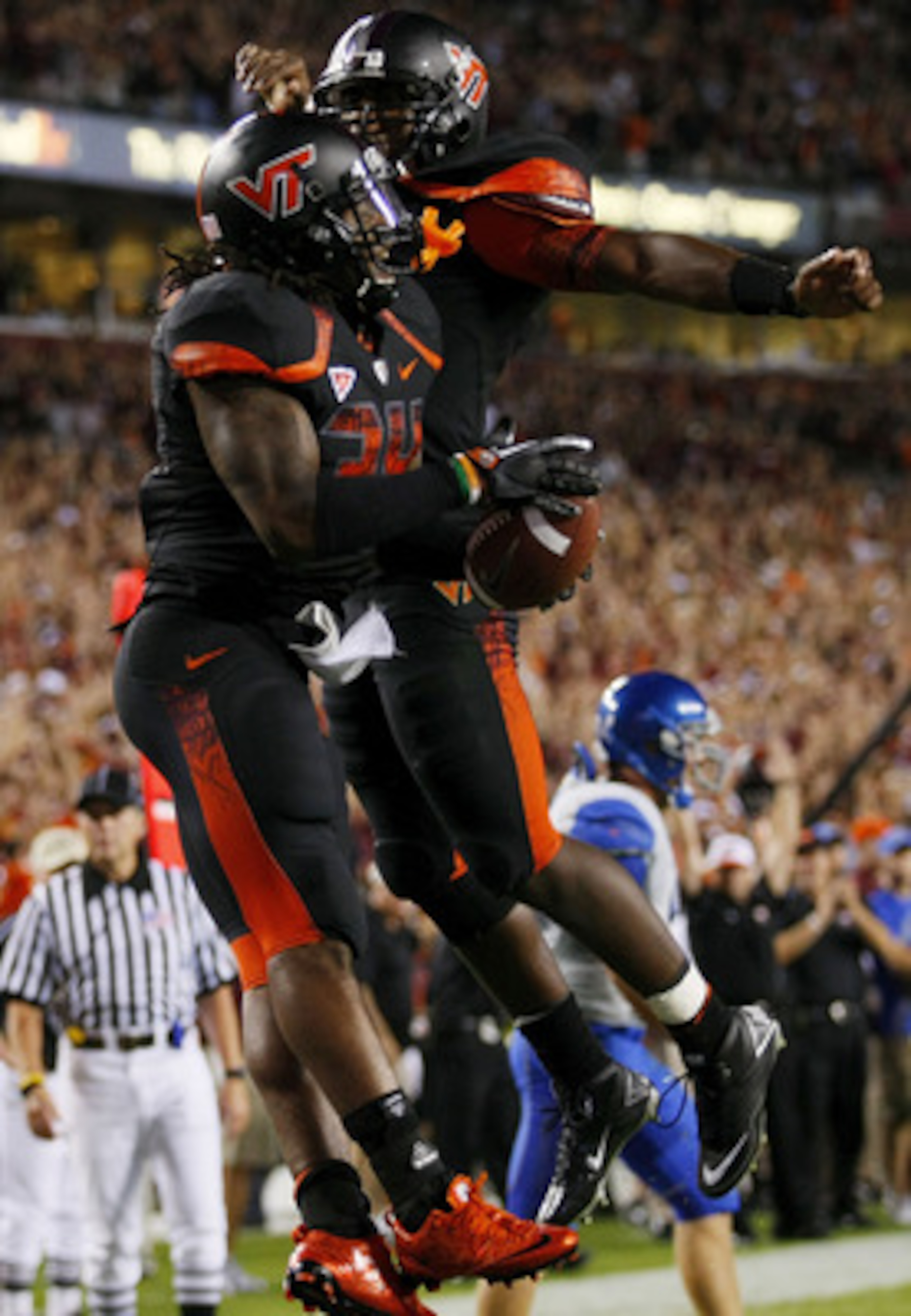 LANDOVER, MD - SEPTEMBER 06:  Running back Ryan Williams #34 of the Virginia Tech Hokies celebrates with quaretrback #7 Tyrod Taylor after a touchdown in the second quarter against the Boise State Broncos at FedExField on September 6, 2010 in Landover, Ma