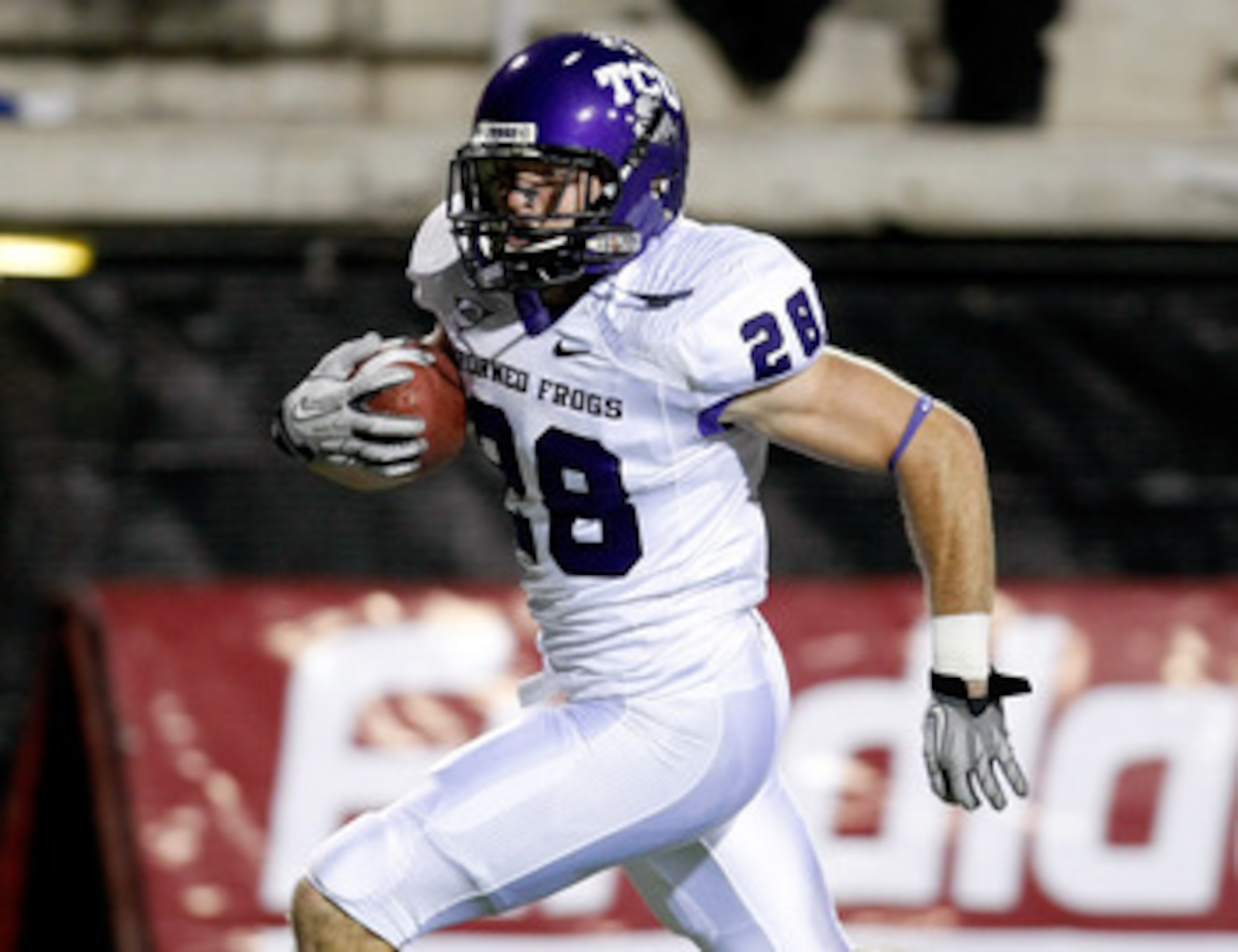 LAS VEGAS - OCTOBER 30:  Colin Jones #28 of the Texas Christian University Horned Frogs runs for a 30-yard touchdown after making an interception against the UNLV Rebels during the second quarter of their game at Sam Boyd Stadium October 30, 2010 in Las V