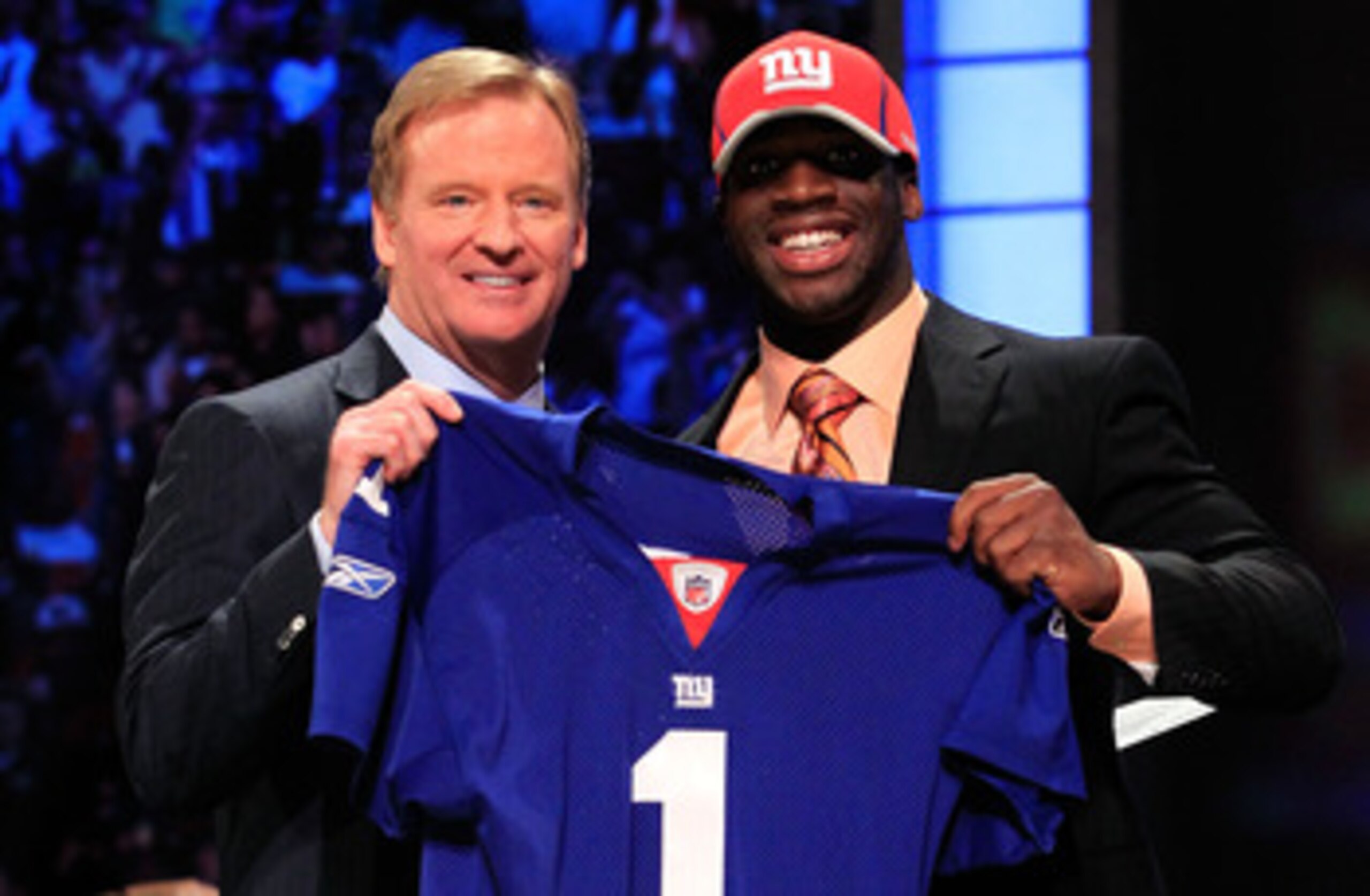 NEW YORK, NY - APRIL 28:  NFL Commissioner Roger Goodell (L) poses for a photo with Prince Amukamara, #19 overall pick by the New York Giants, on stage during the 2011 NFL Draft at Radio City Music Hall on April 28, 2011 in New York City.  (Photo by Chris
