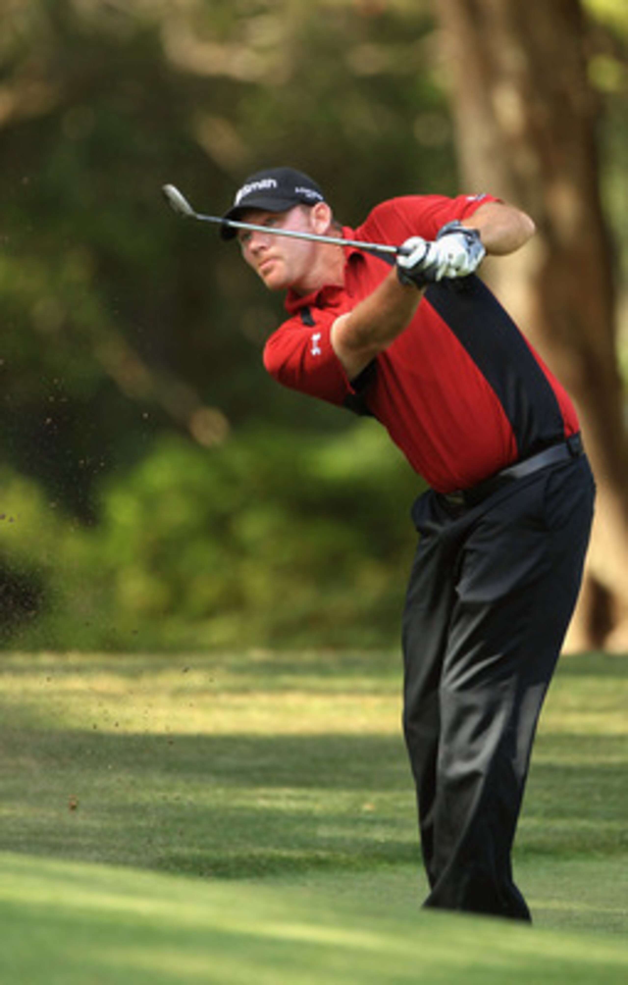 HILTON HEAD ISLAND, SC - APRIL 24:  Tommy Gainey hits a shot on the 13th hole during the final round of The Heritage at Harbour Town Golf Links on April 24, 2011 in Hilton Head Island, South Carolina.  (Photo by Streeter Lecka/Getty Images)