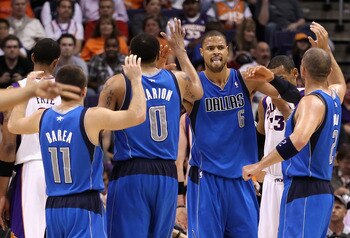 PHOENIX, AZ - MARCH 27: Tyson Chandler #6 of the Dallas Mavericks high fives teammates Jose Barea #11, Shawn Marion #0 and Jason Kidd #2 after scoring against the Phoenix Suns during the NBA game at US Airways Center on March 27, 2011 in Phoenix, Arizona PHOENIX, AZ - MARCH 27: Tyson Chandler #6 of the Dallas Mavericks high fives teammates Jose Barea #11, Shawn Marion #0 and Jason Kidd #2 after scoring against the Phoenix Suns during the NBA game at US Airways Center on March 27, 2011 in Phoenix, Arizona