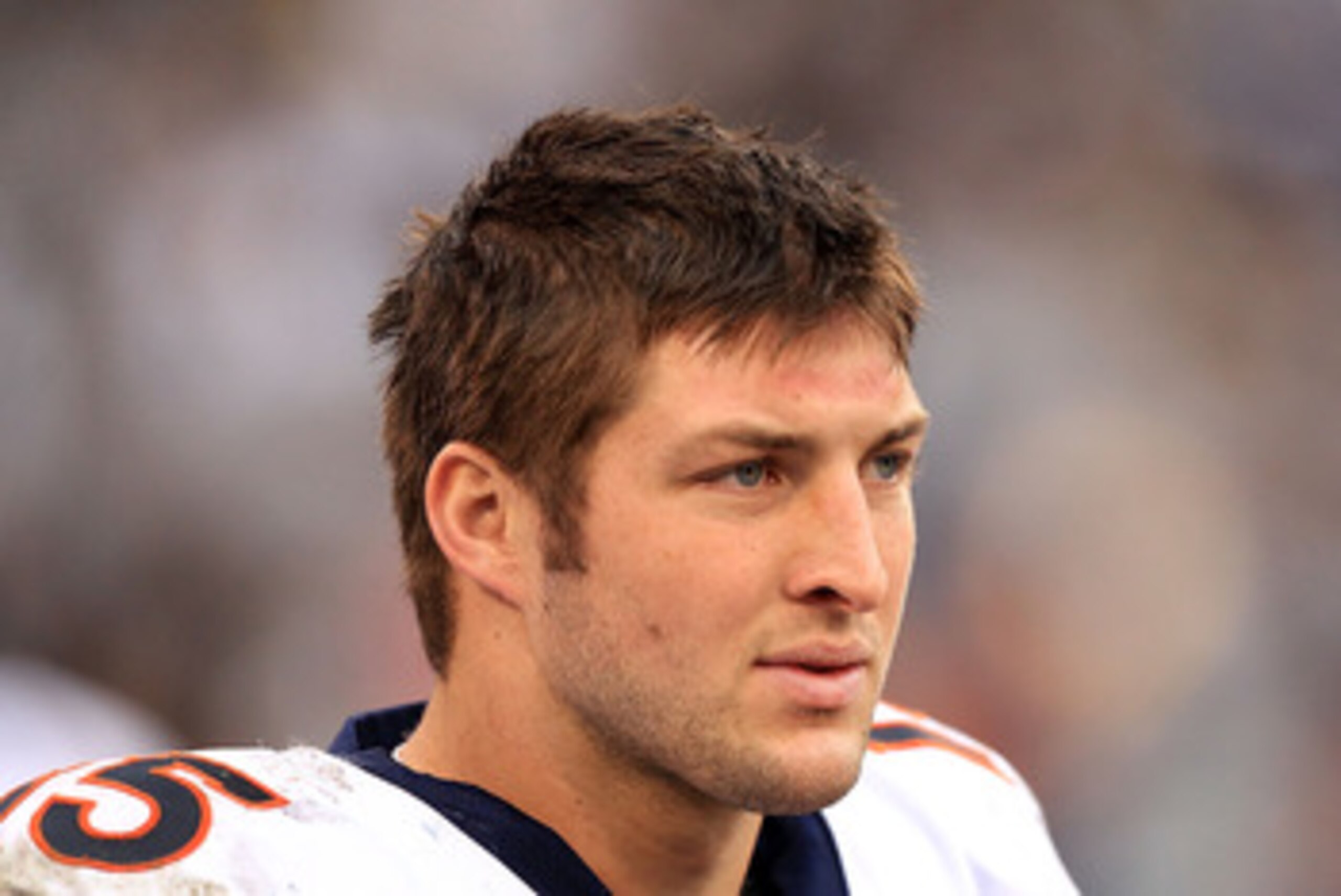 DENVER - DECEMBER 26: Quarterback Tim Tebow #15 of the Denver Broncos rolls out and looks to deliver a pass against the Houston Texas at INVESCO Field at Mile High on December 26, 2010 in Denver, Colorado. The Broncos defeated the Texans 24-23. (Photo b DENVER - DECEMBER 26: Quarterback Tim Tebow #15 of the Denver Broncos rolls out and looks to deliver a pass against the Houston Texas at INVESCO Field at Mile High on December 26, 2010 in Denver, Colorado. The Broncos defeated the Texans 24-23. (Photo b