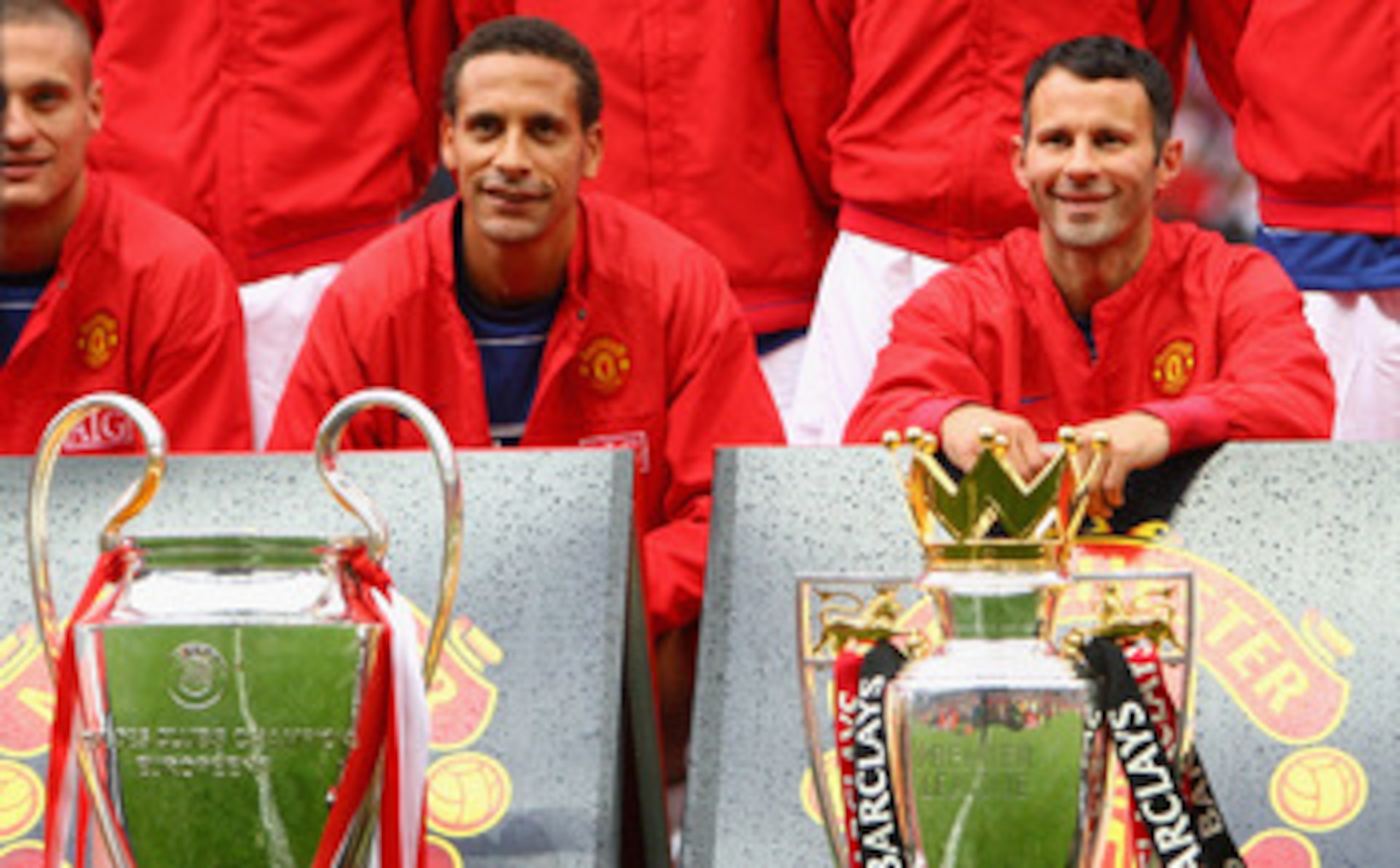 MANCHESTER, UNITED KINGDOM - AUGUST 06: Rio Ferdinand of Manchester United and team mate Ryan Giggs (R) pose with the Premier League and Champions League trophies prior to the Pre Season Friendly match between Manchester United and Juventus at Old Traffo MANCHESTER, UNITED KINGDOM - AUGUST 06: Rio Ferdinand of Manchester United and team mate Ryan Giggs (R) pose with the Premier League and Champions League trophies prior to the Pre Season Friendly match between Manchester United and Juventus at Old Traffo