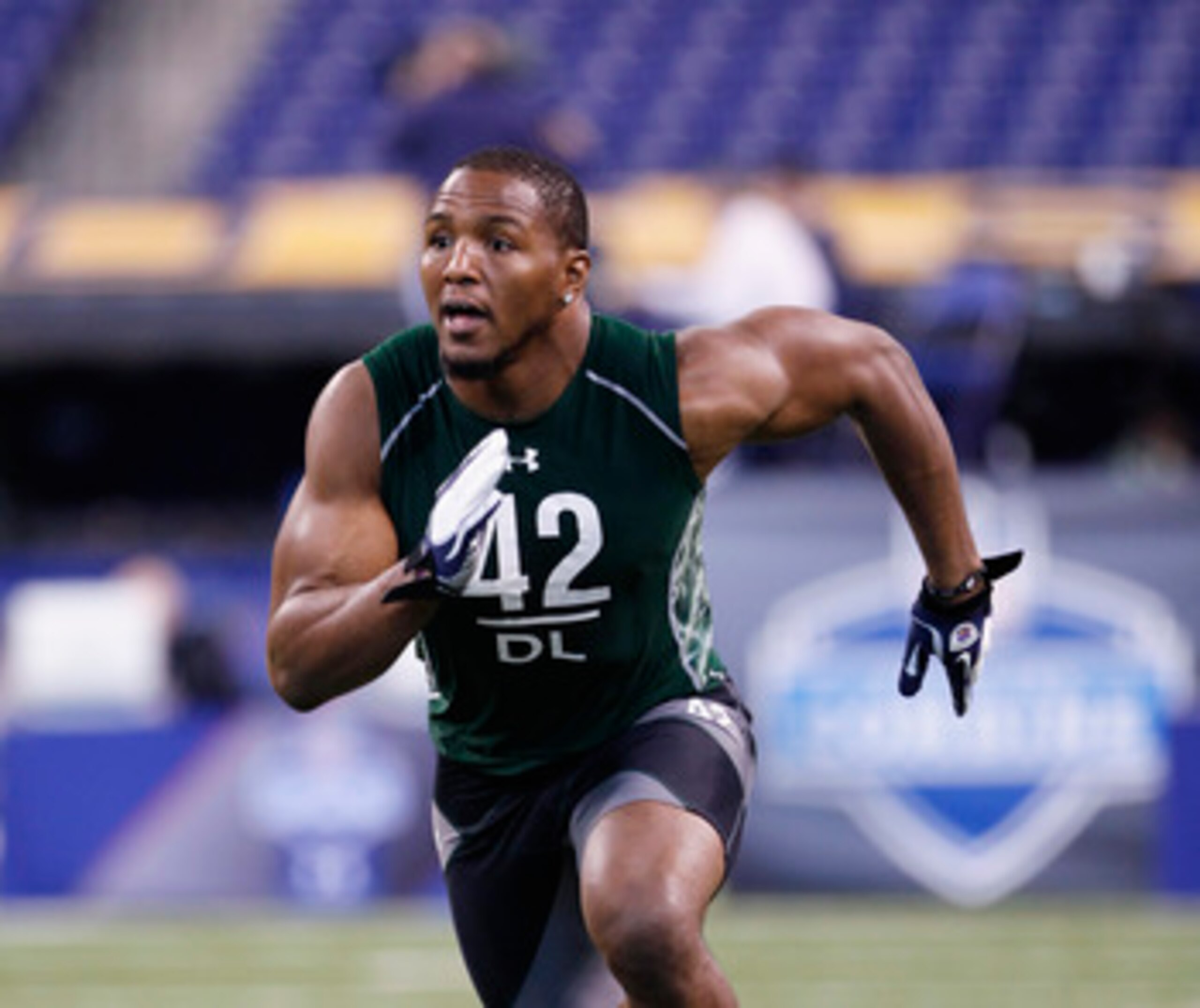 INDIANAPOLIS, IN - FEBRUARY 28: Defensive lineman Robert Quinn of North Carolina runs through a drill during the 2011 NFL Scouting Combine at Lucas Oil Stadium on February 28, 2011 in Indianapolis, Indiana. (Photo by Joe Robbins/Getty Images) INDIANAPOLIS, IN - FEBRUARY 28: Defensive lineman Robert Quinn of North Carolina runs through a drill during the 2011 NFL Scouting Combine at Lucas Oil Stadium on February 28, 2011 in Indianapolis, Indiana. (Photo by Joe Robbins/Getty Images)
