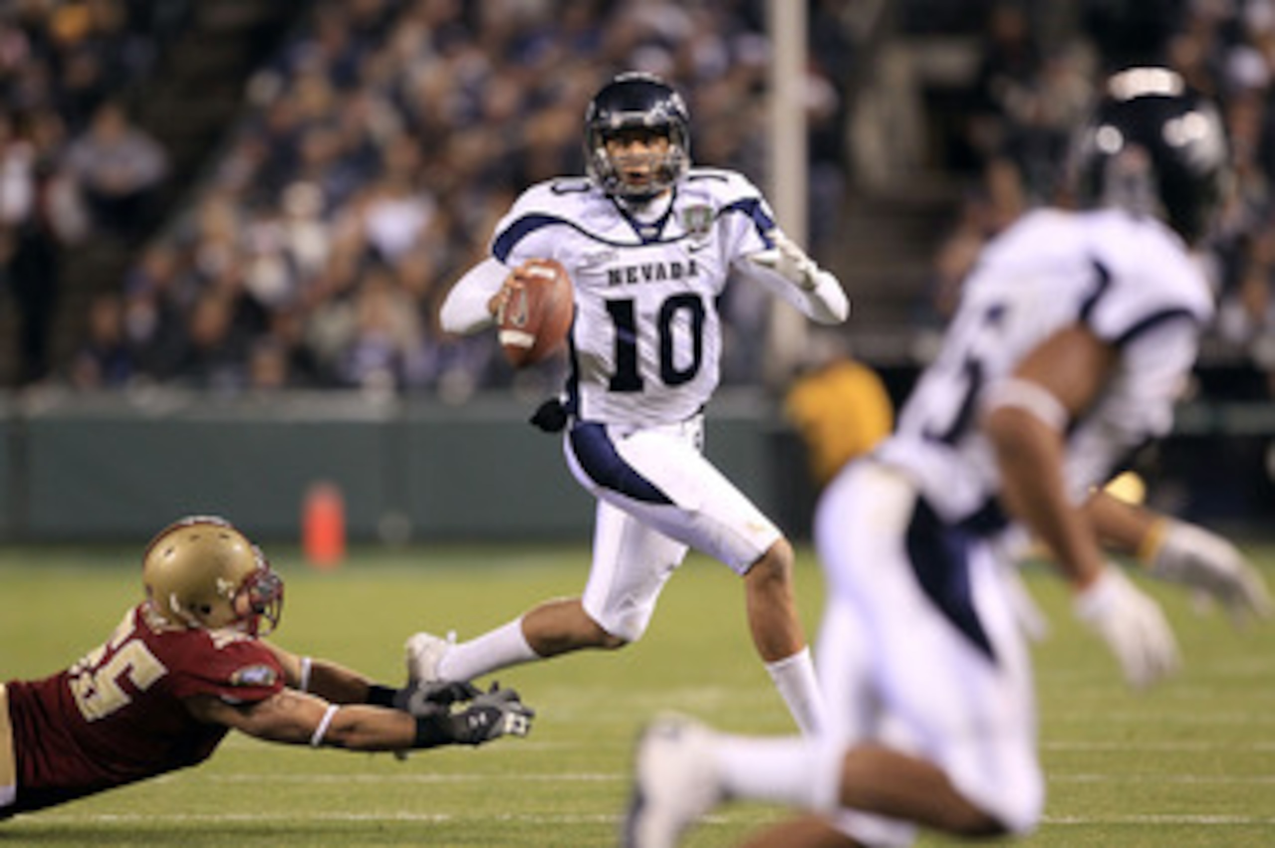 SAN FRANCISCO, CA - JANUARY 09: Colin Kaepernick #10 of the Nevada Wolf Pack looks to pass the ball against Boston College during the Kraft Fight Hunger Bowl at AT&T Park on January 9, 2011 in San Francisco, California. (Photo by Ezra Shaw/Getty Images) SAN FRANCISCO, CA - JANUARY 09: Colin Kaepernick #10 of the Nevada Wolf Pack looks to pass the ball against Boston College during the Kraft Fight Hunger Bowl at AT&T Park on January 9, 2011 in San Francisco, California. (Photo by Ezra Shaw/Getty Images)