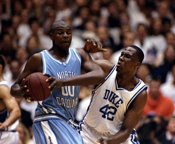 27 Jan 1999: Elton Brand #42 of the Duke Blue Devils tries to guard Brendan Haywood #00 of the North Carolina Tar Heels at the Cameron Indoor Stadium in Durham, North Carolina. The Blue Devils defeated the Tar Heels 89-77.