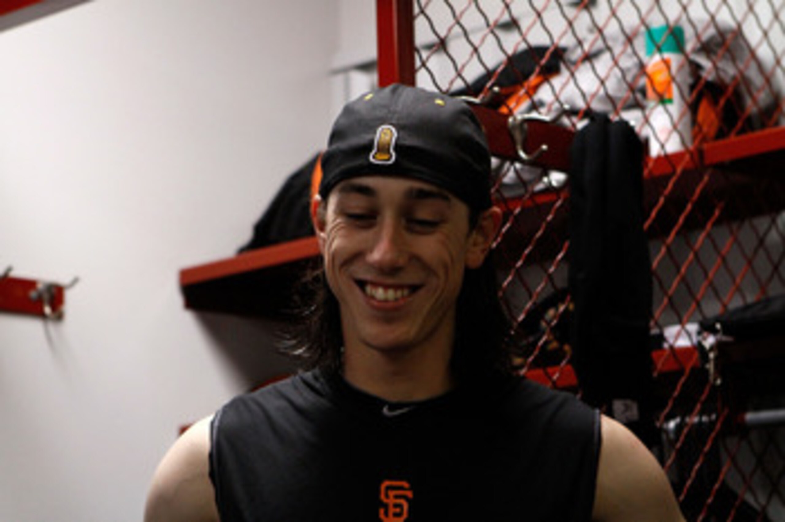 ARLINGTON, TX - NOVEMBER 01:  Tim Lincecum #55 of the San Francisco Giants smiles in the locker room after the Giants won 3-1 against the Texas Rangers in Game Five of the 2010 MLB World Series at Rangers Ballpark in Arlington on November 1, 2010 in Arlin