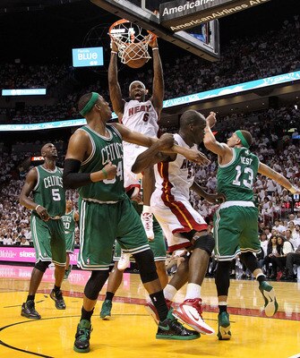 MIAMI, FL - MAY 03:  LeBron James #6 of the Miami Heat dunks over Paul Pierce #34 and Delonte West #13 of  the Boston Celtics during Game Two of the Eastern Conference Semifinals of the 2011 NBA Playoffs at American Airlines Arena on May 3, 2011 in Miami,
