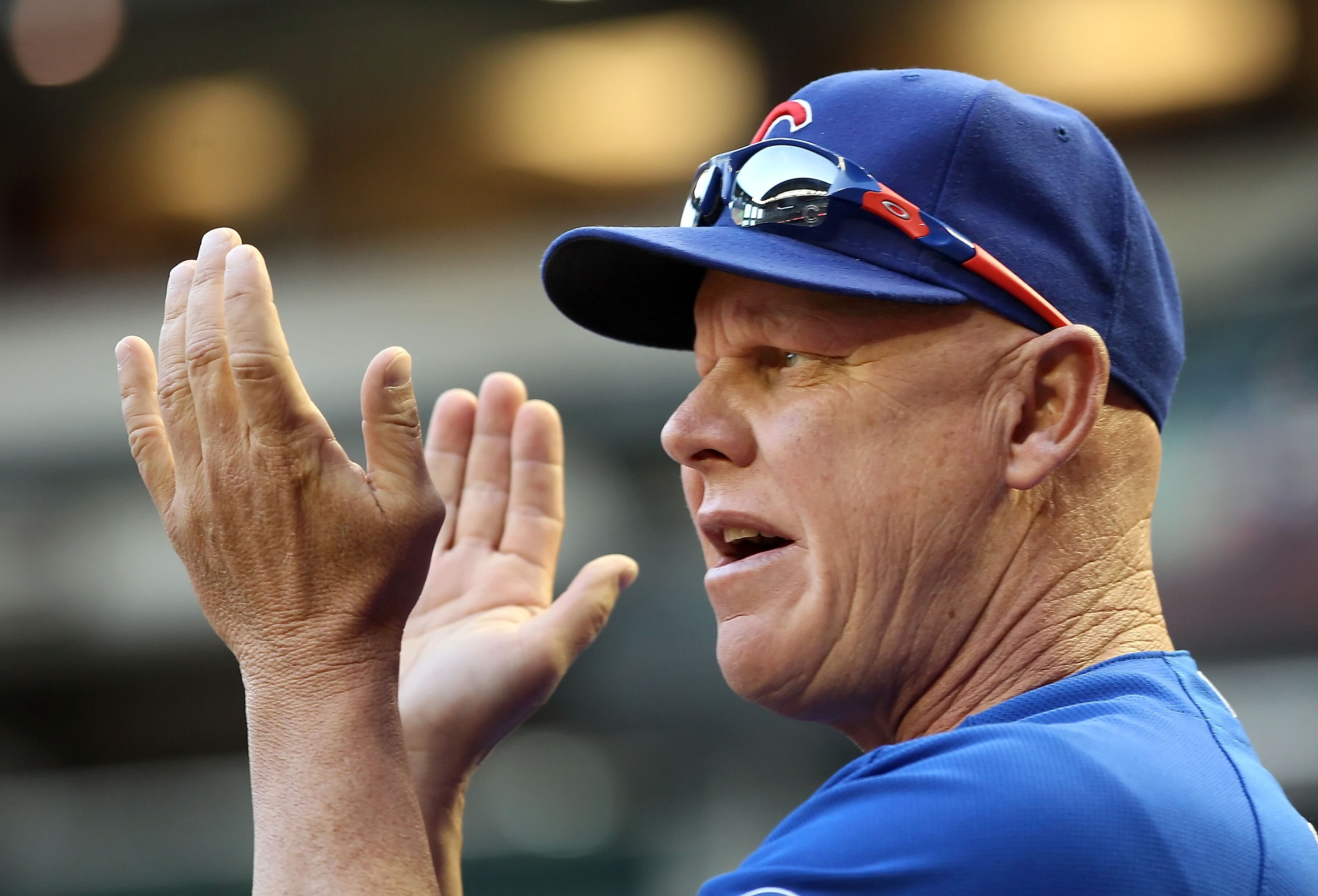 PHOENIX, AZ - APRIL 30:  Manager Mike Quade of the Chicago Cubs applauds from the dugout during the Major League Baseball game against the Arizona Diamondbacks at Chase Field on April 30, 2011 in Phoenix, Arizona.  The Cubs defeated the Diamondbacks 5-3.