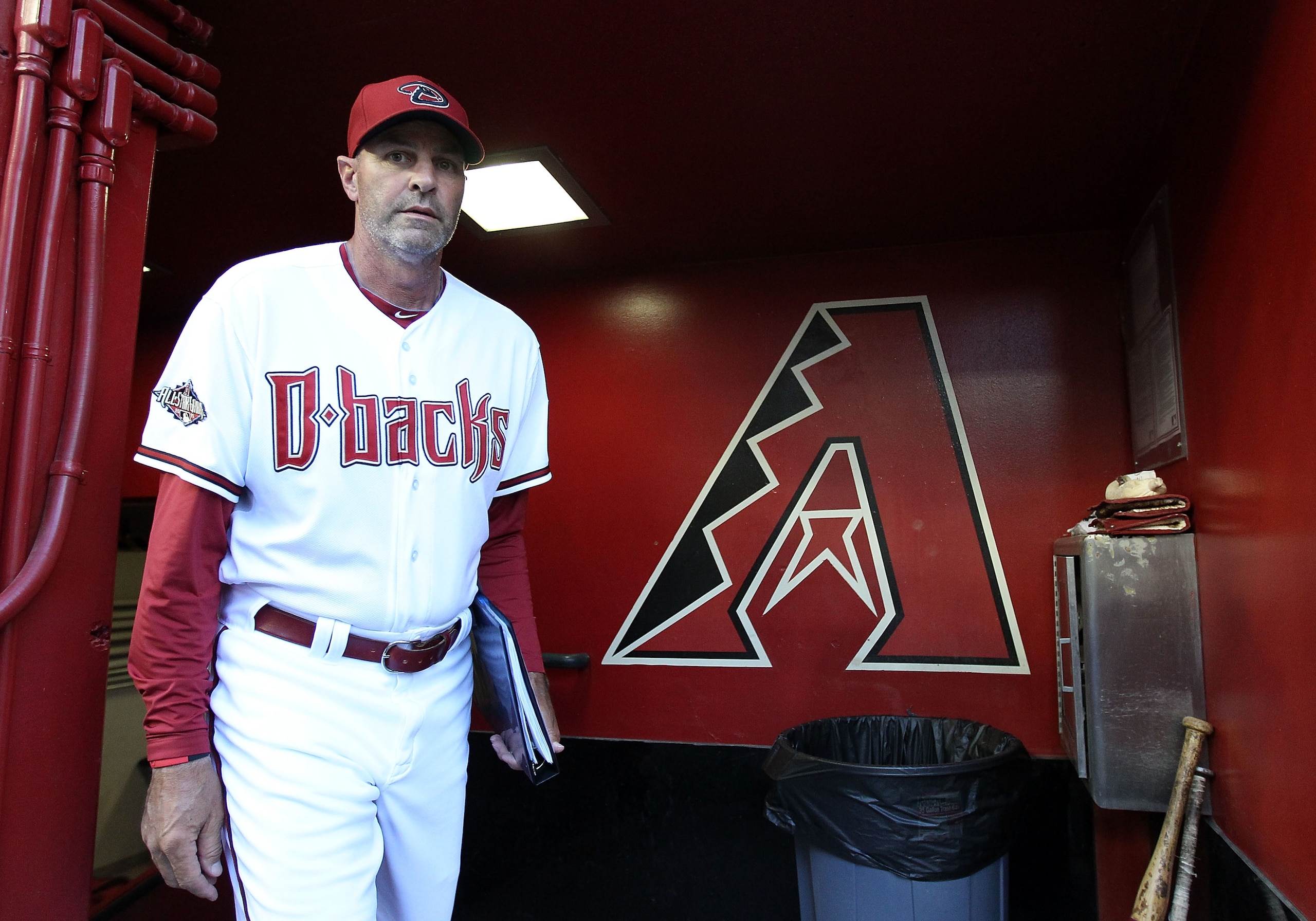 PHOENIX, AZ - APRIL 12:  Manager Kirk Gibson of the Arizona Diamondbacks walks out into the dugout before the Major League Baseball game against the St. Louis Cardinals at Chase Field on April 12, 2011 in Phoenix, Arizona.  (Photo by Christian Petersen/Ge