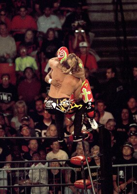 SAN DIEGO - JULY 12:  Jericho (front) defends his cruiserweight belt against Rey Mysterio Jr as they duke it out on the ropes during the WWE Bash at the Beach event at Cox Arena in San Diego, California on July 12, 1998. Mysterio became the new cruiserwei