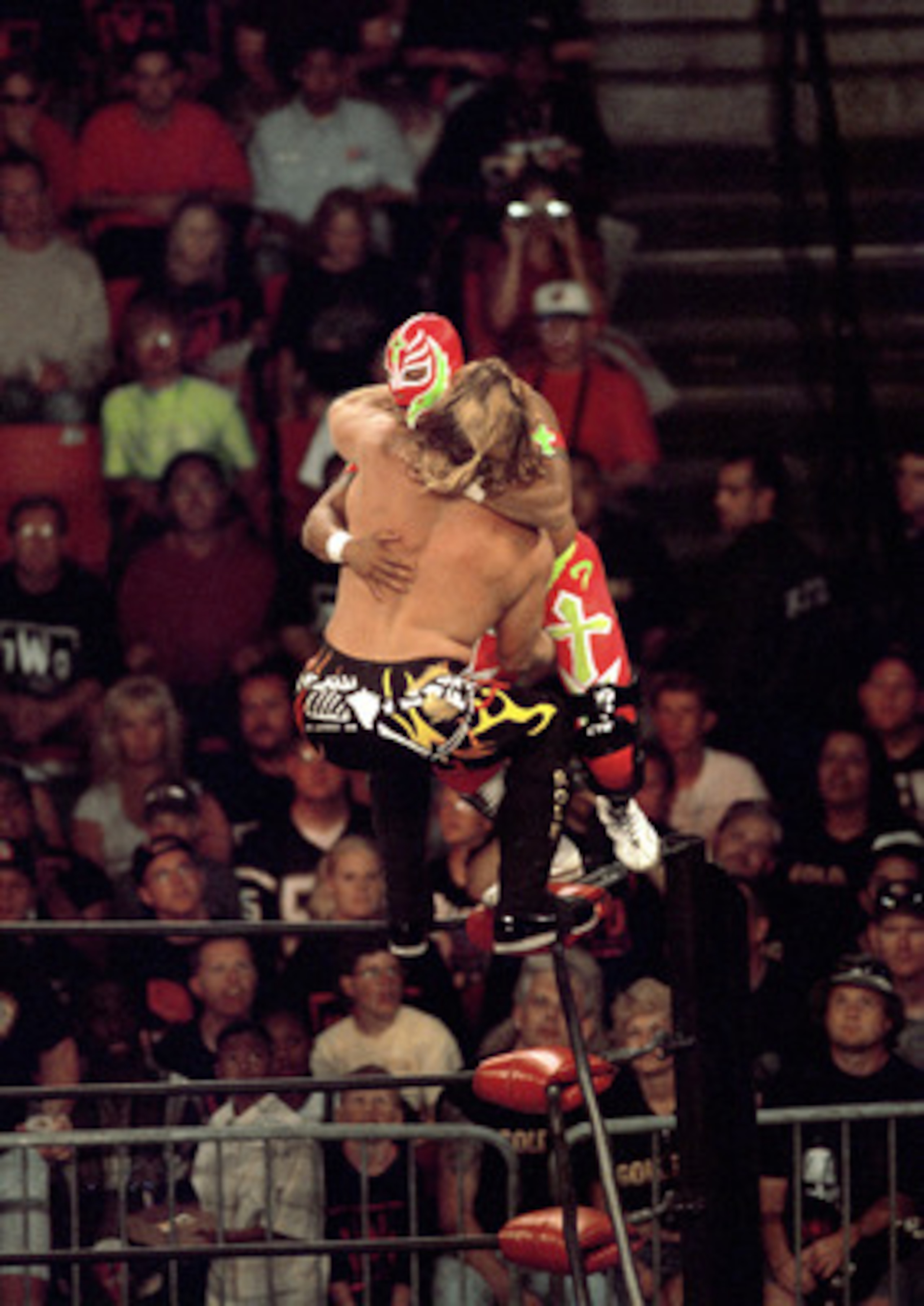 SAN DIEGO - JULY 12: Jericho (front) defends his cruiserweight belt against Rey Mysterio Jr as they duke it out on the ropes during the WWE Bash at the Beach event at Cox Arena in San Diego, California on July 12, 1998. Mysterio became the new cruiserwei SAN DIEGO - JULY 12: Jericho (front) defends his cruiserweight belt against Rey Mysterio Jr as they duke it out on the ropes during the WWE Bash at the Beach event at Cox Arena in San Diego, California on July 12, 1998. Mysterio became the new cruiserwei