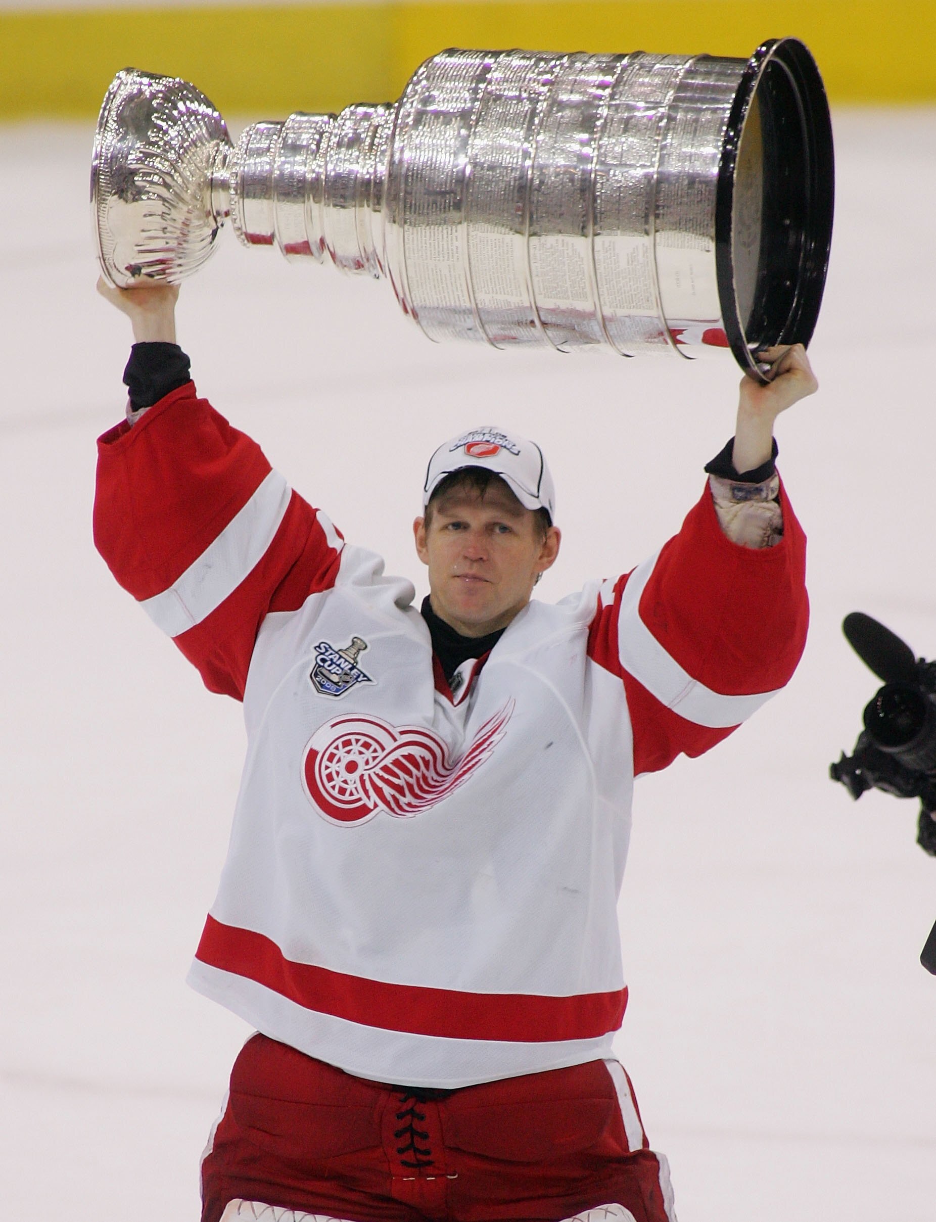 PITTSBURGH - JUNE 04:  Chris Osgood #30 of the Detroit Red Wings celebrates with the Stanley Cup after defeating the Pittsburgh Penguins in game six of the 2008 NHL Stanley Cup Finals at Mellon Arena on June 4, 2008 in Pittsburgh. Pennsylvania. The Red Wi