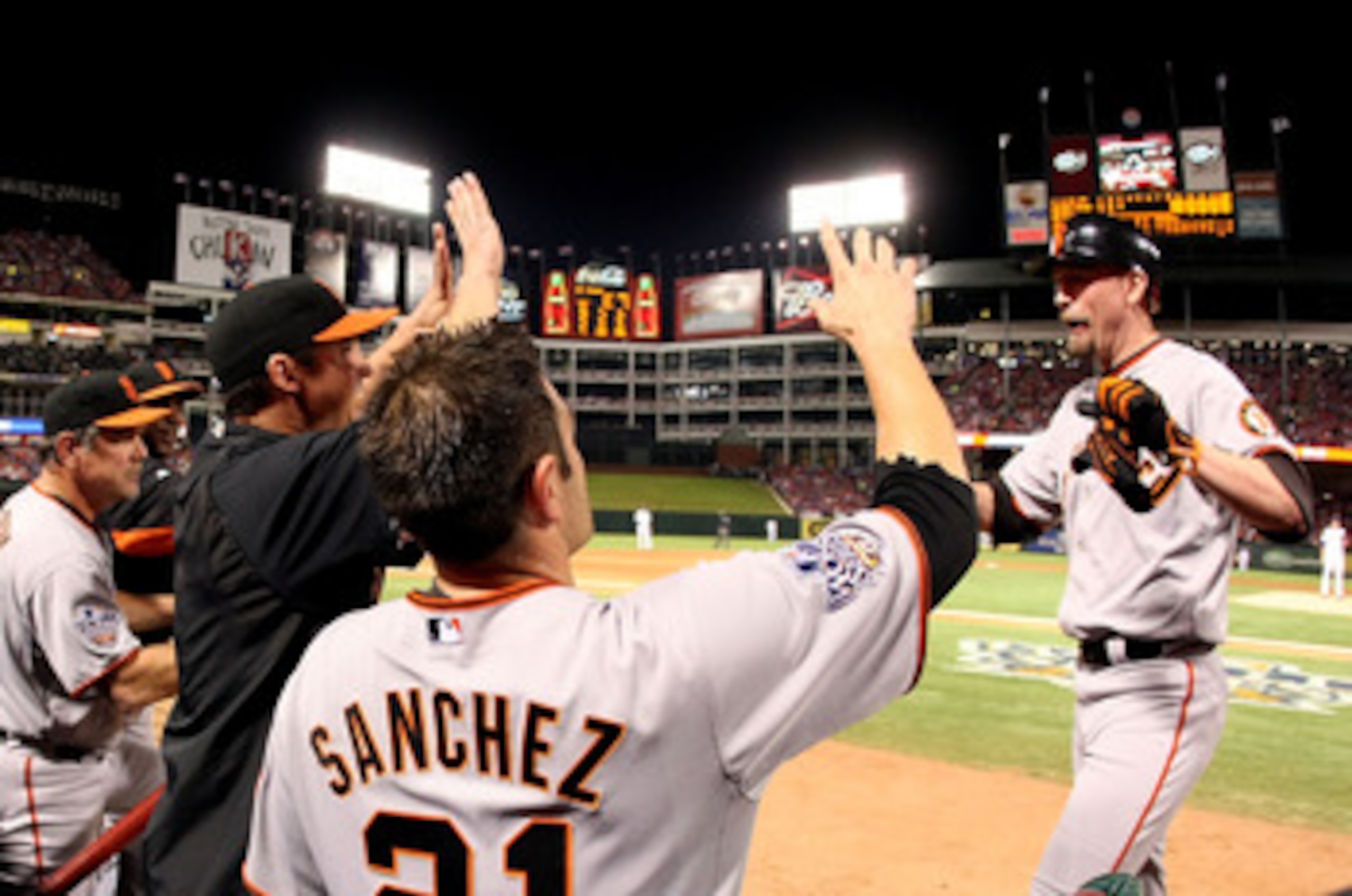 ARLINGTON, TX - OCTOBER 31:  Aubrey Huff #17 of the San Francisco Giants is congratulated by teammates after his two-run home run in the top of the third inning against the Texas Rangers in Game Four of the 2010 MLB World Series at Rangers Ballpark in Arl