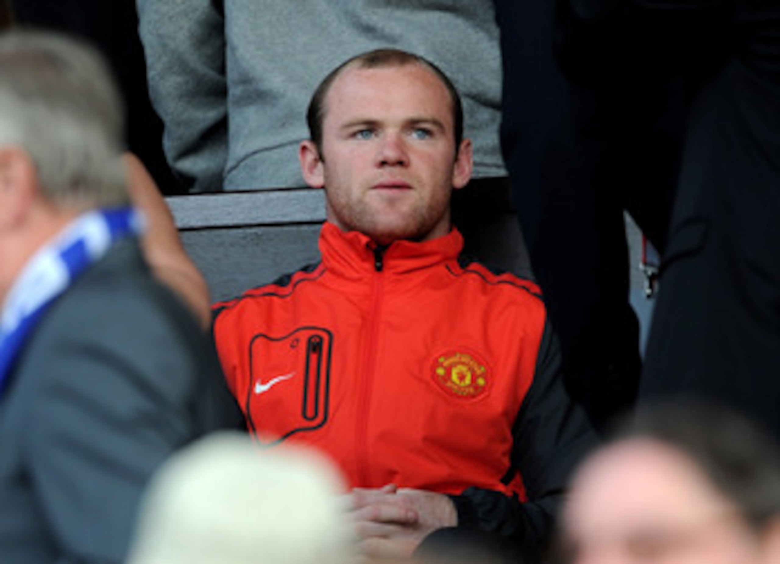 MANCHESTER, ENGLAND - MAY 04:  Wayne Rooney of Manchester United watches from the stands during the UEFA Champions League Semi Final second leg match between Manchester United and Schalke at Old Trafford on May 4, 2011 in Manchester, England. (Photo by Mi
