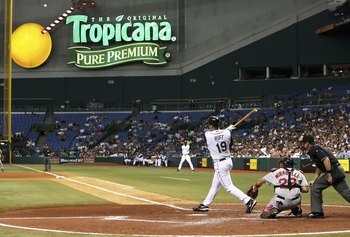 ST. PETERSBURG, FL - JULY 06:  Aubrey Huff #19 of the Tampa Bay Devil Rays hits a solo home run in the 4th inning against the Boston Red Sox at Tropicana Field on July 6, 2006 in St. Petersburg, Florida.  (Photo by Doug Benc/Getty Images)