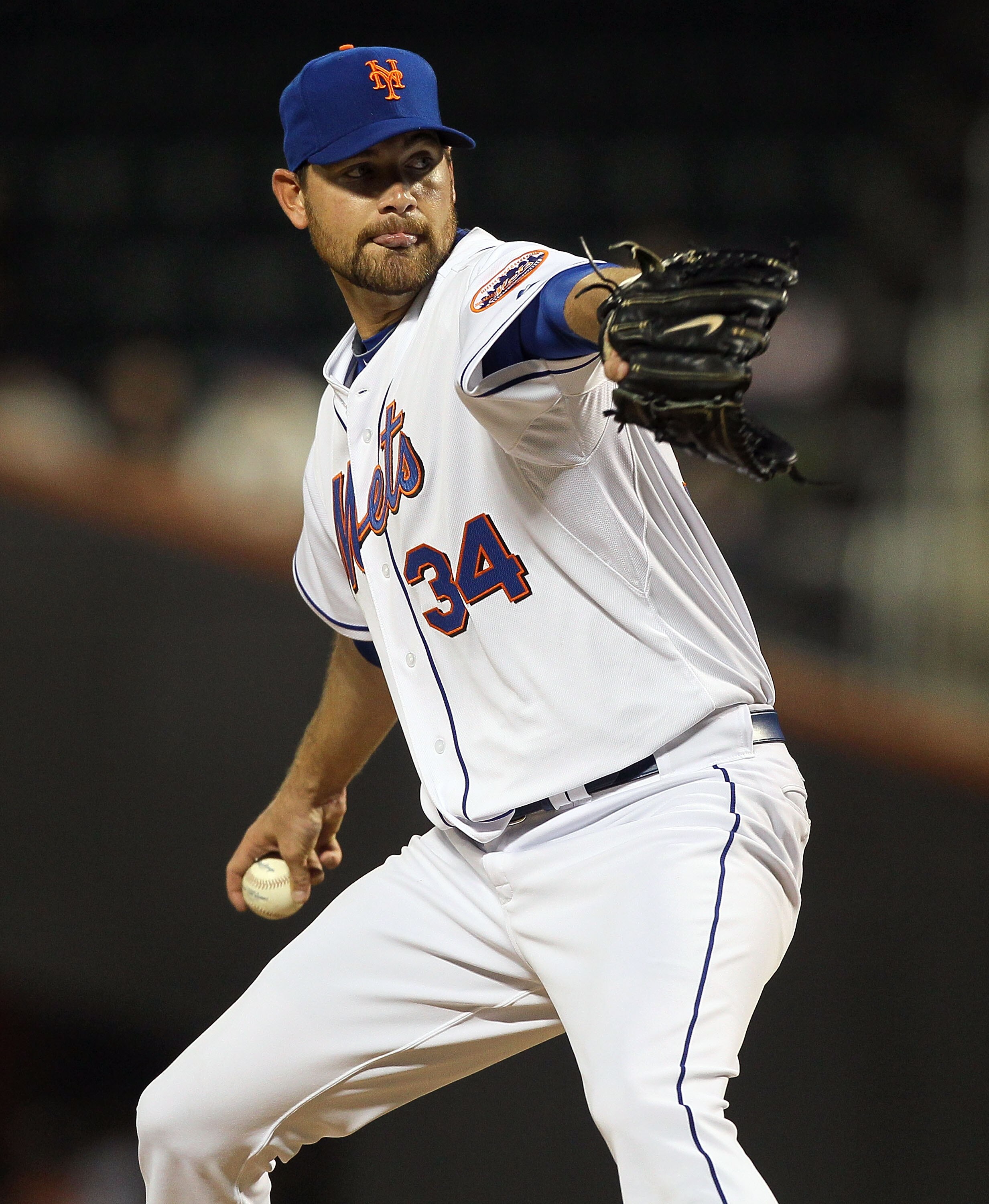 NEW YORK, NY - APRIL 11:  Mike Pelfrey #34 of the New York Mets deals a pitch against the Colorado Rockies on April 11, 2011 at Citi Field in the Flushing neighborhood of the Queens borough of New York City.  (Photo by Jim McIsaac/Getty Images)
