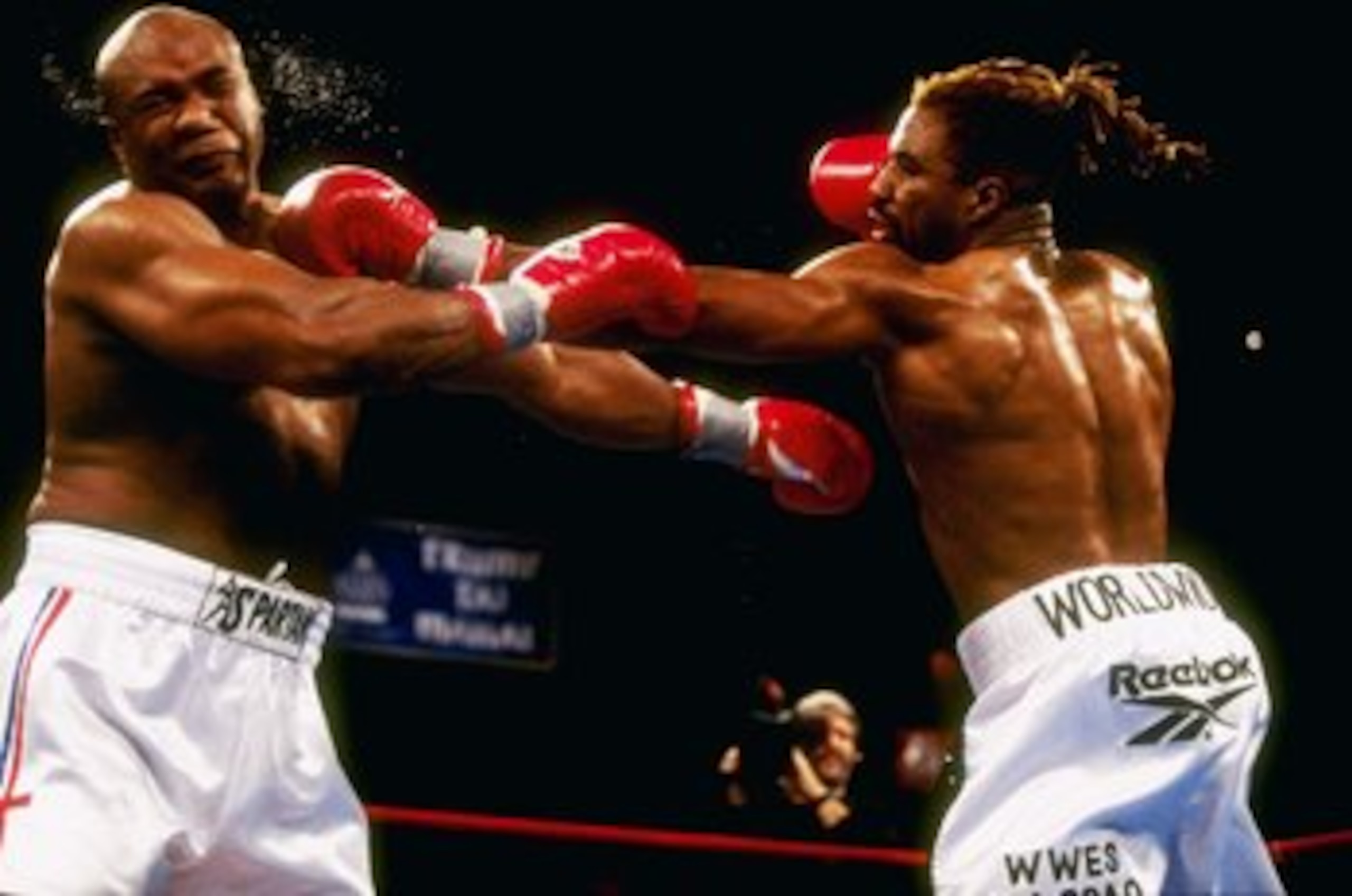 22 Nov 1997:  Shannon Briggs (right) hits George Foreman with a left jab during their bout at Mark Etess Arena in the Taj Mahal Hotel in Atlantic City, New Jersey.  Briggs won the bout by way of decision after 10 rounds. Mandatory Credit: Al Bello  /Allsp