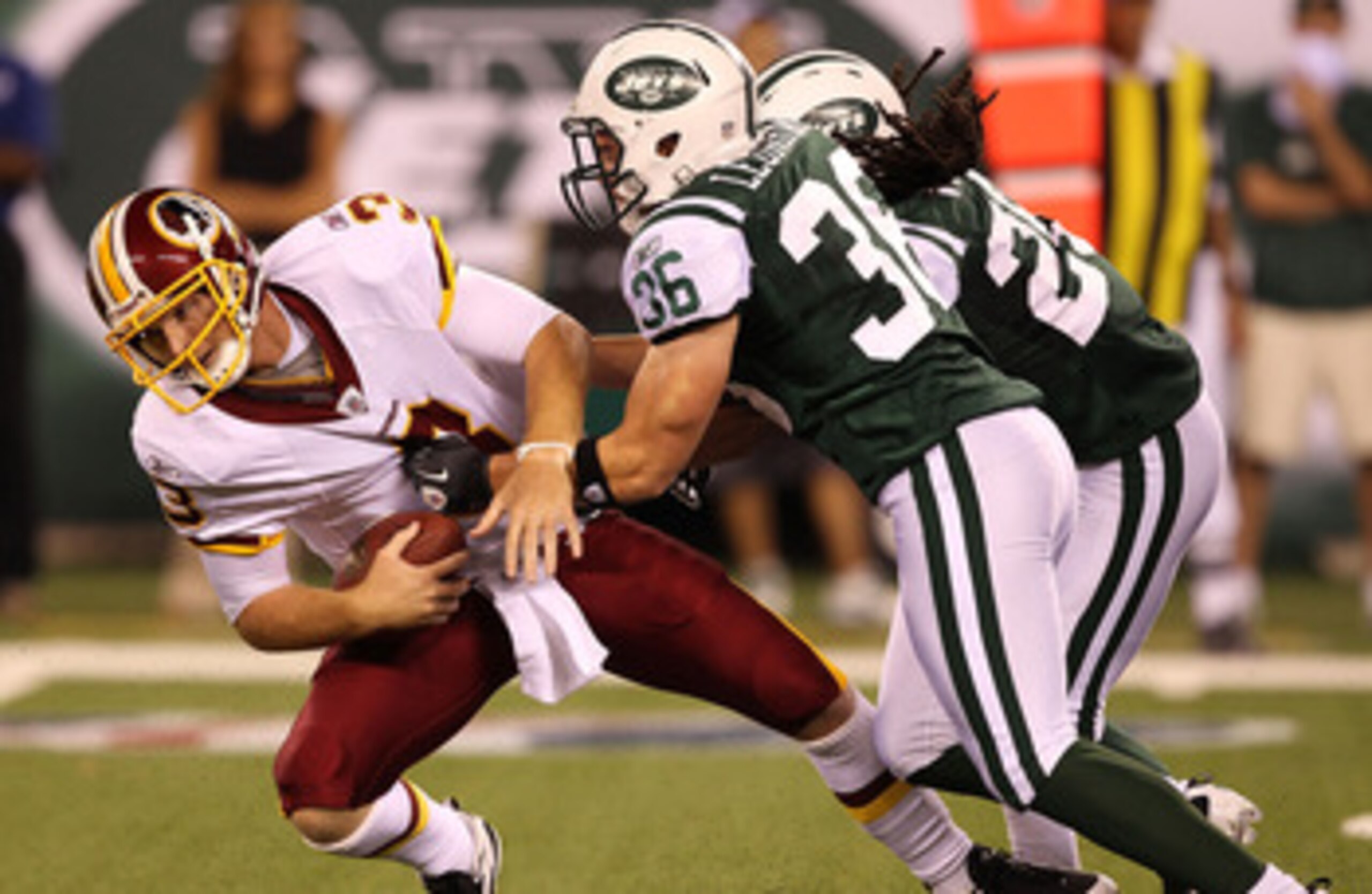 EAST RUTHERFORD, NJ - AUGUST 27:  Jim Leonhard #36 of the New York Jets sacks John Beck #3 of the Washington Redskins  during their preseason game on August 27, 2010 at the New Meadowlands Stadium  in East Rutherford, New Jersey.  (Photo by Al Bello/Getty